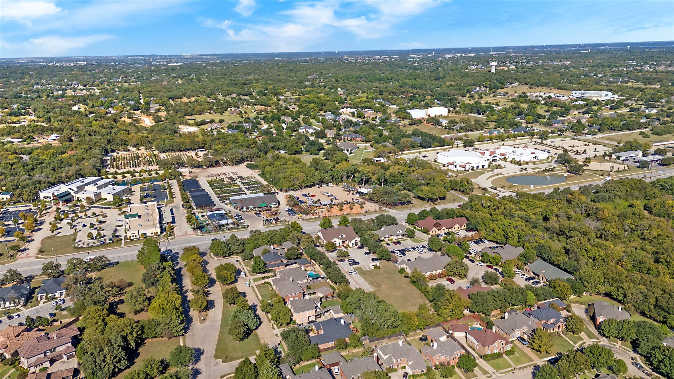 Aerial overview of property's location featuring nearby suburban area