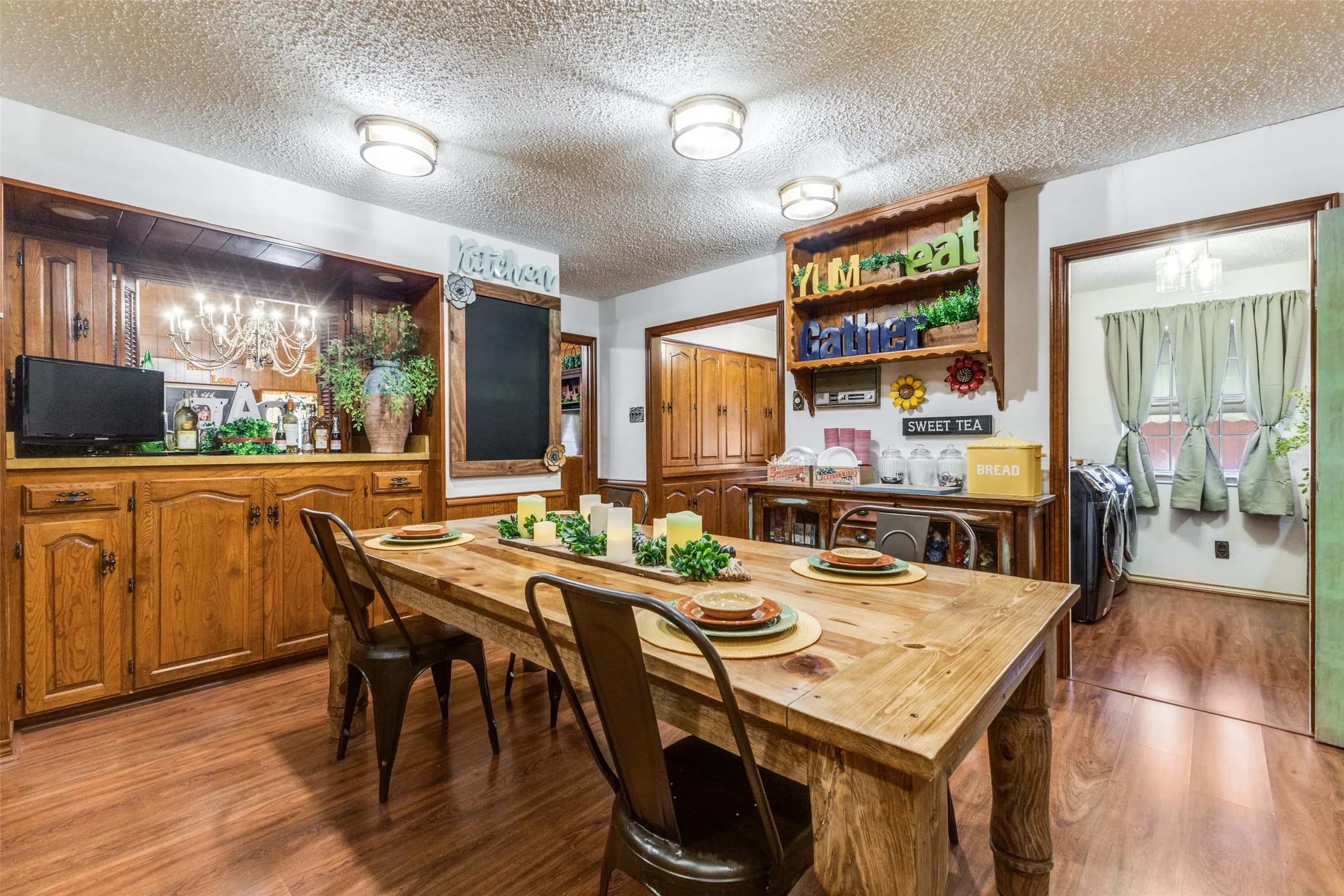 Dining space has additional built-in cabinets for all of your dishes and utensils.  Walk-in pantry and utility room are adjacent to kitchen for convenience.