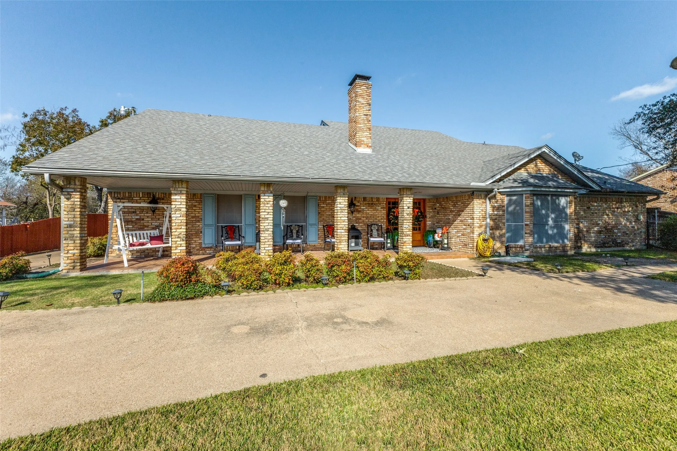 The front of this home features a covered porch, a landscaped front yard and established shade trees.  Bonus: room for guests to park in front with parking for up to 5 cars in the garage and carport in the​​‌​​​​‌​​‌‌​‌‌​​​‌‌​‌​‌​‌​​​‌​​ back!