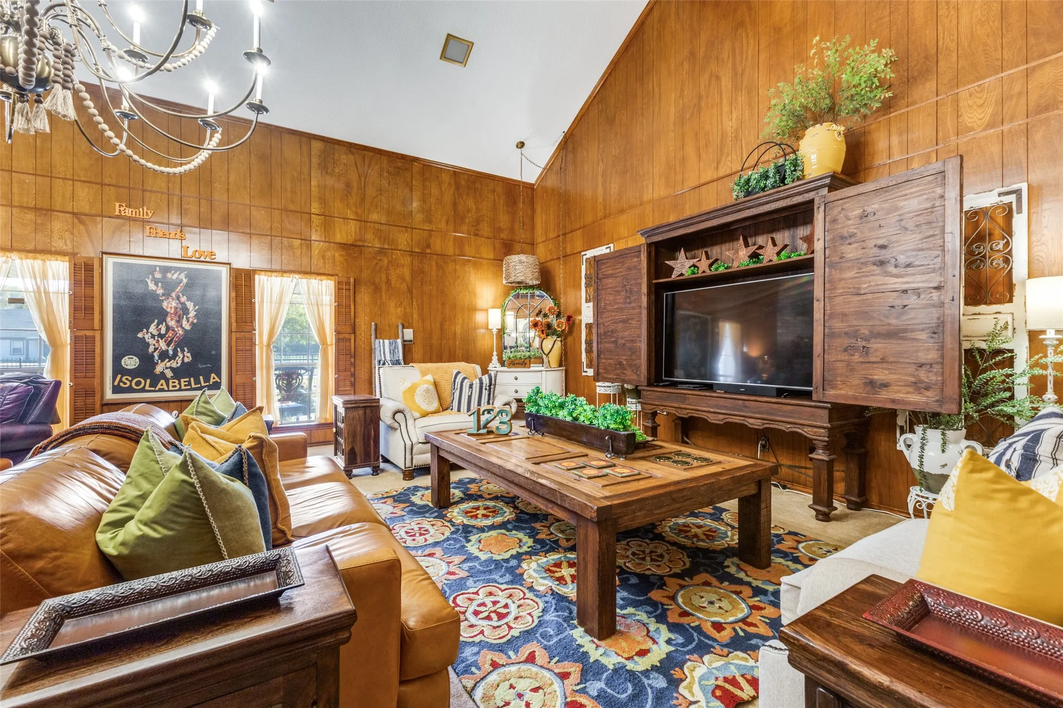 Living area wood paneled walls presents a cozy, warm feel for a living area.