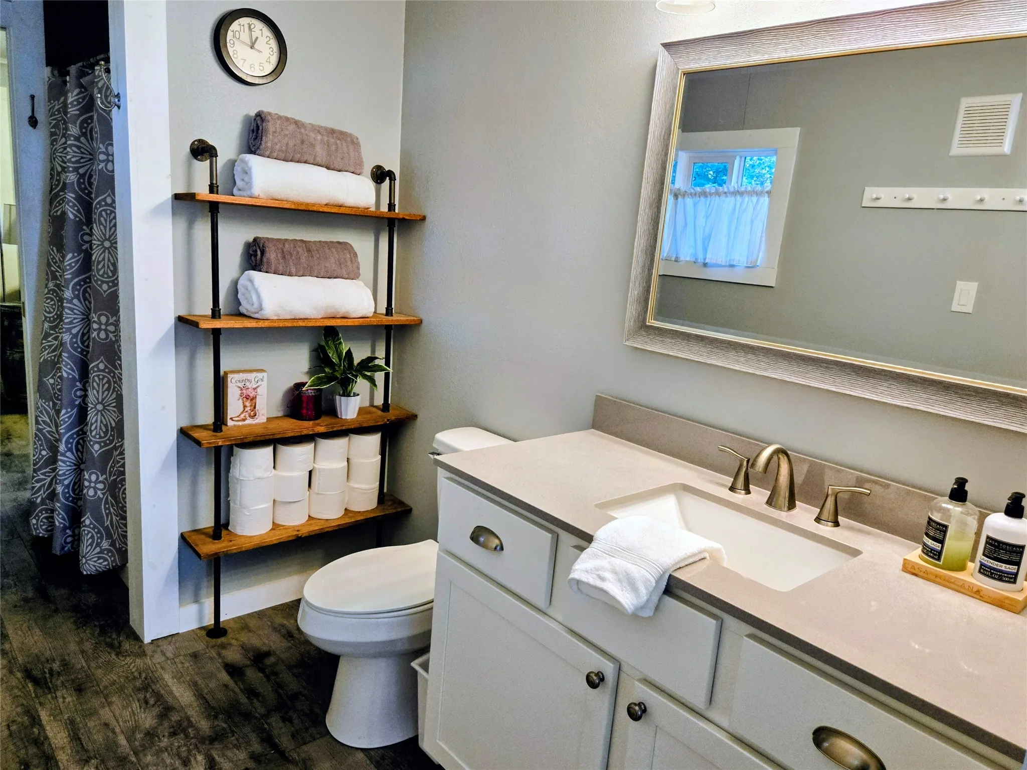 Full bath featuring a shower with shower curtain, vanity