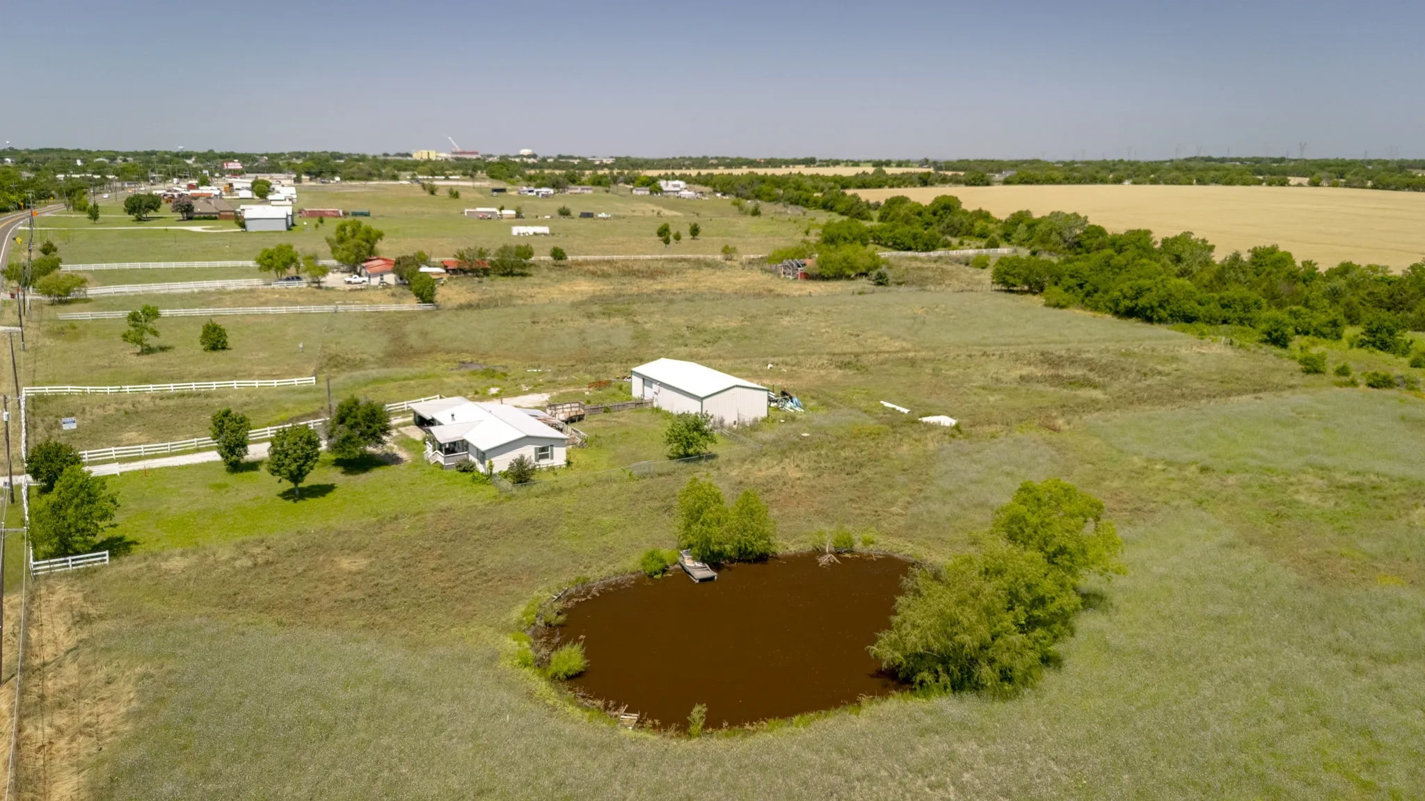 Overview of rural landscape featuring a nearby body of water