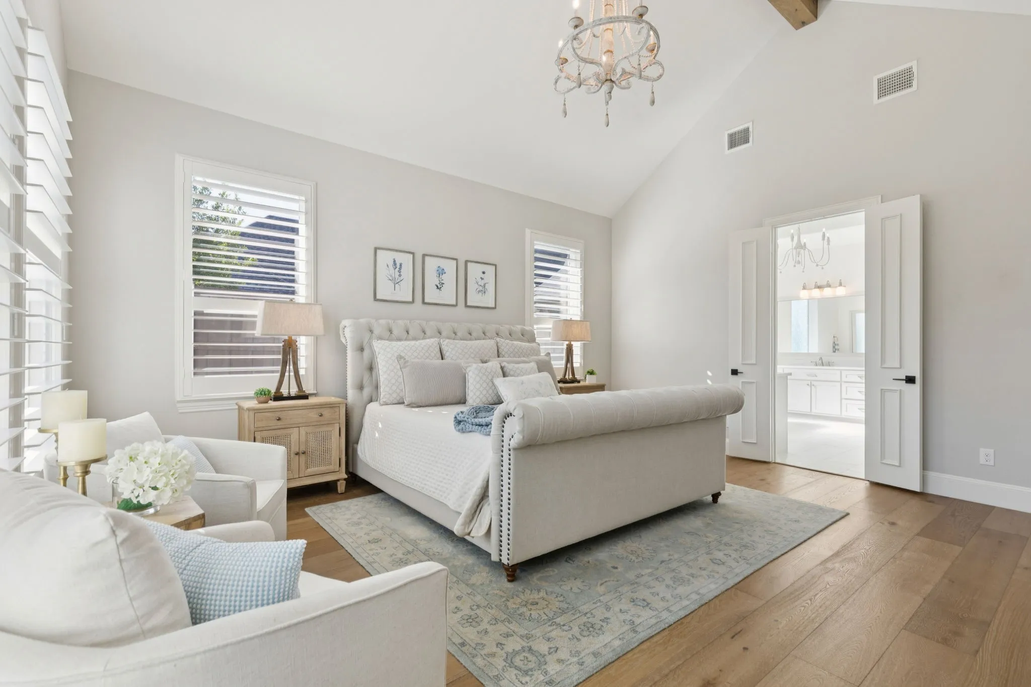 Bedroom with wood-type flooring, a chandelier, high vaulted ceiling, multiple windows, and beam ceiling