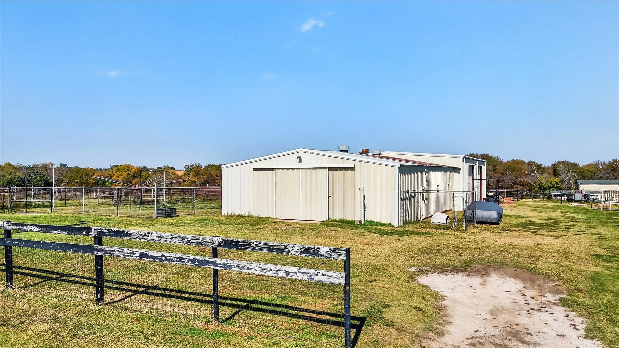 View of pole building featuring a view of rural / pastoral area and view of scattered trees