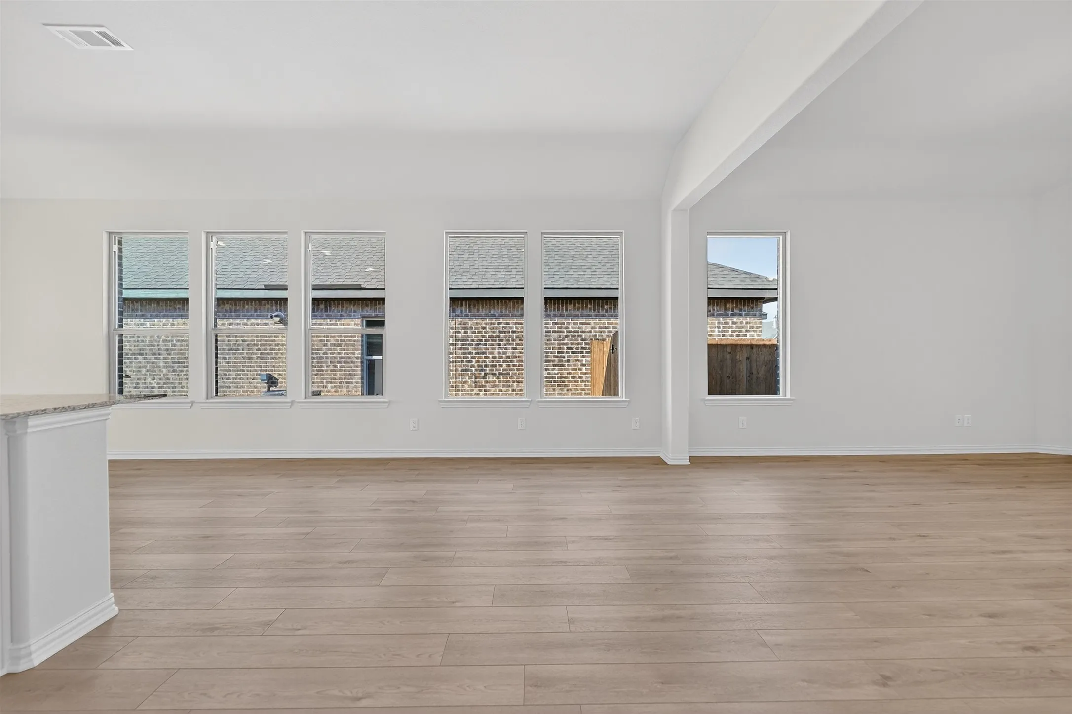 Empty room with light wood-style flooring