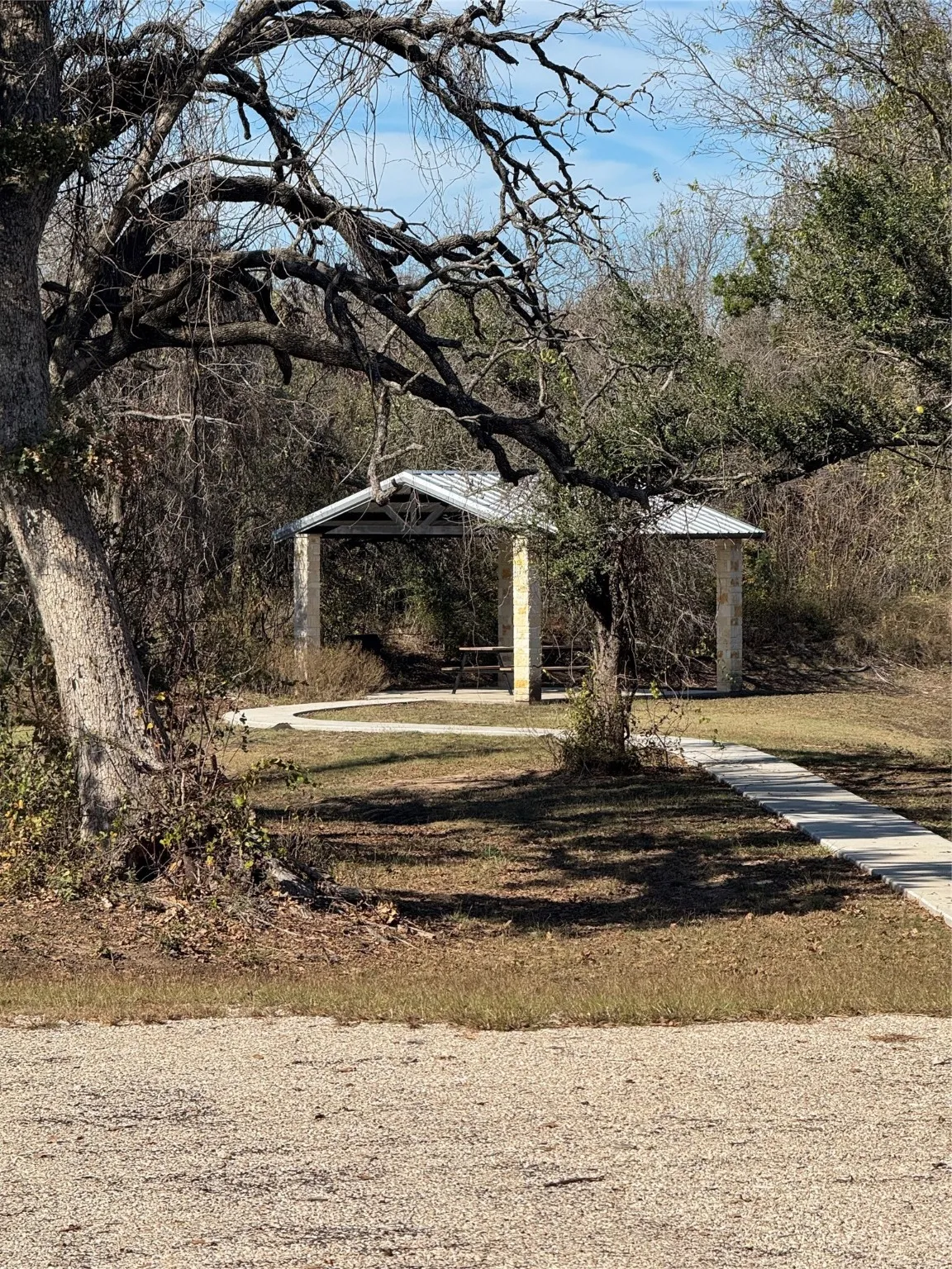 View of grassy yard with a patio area