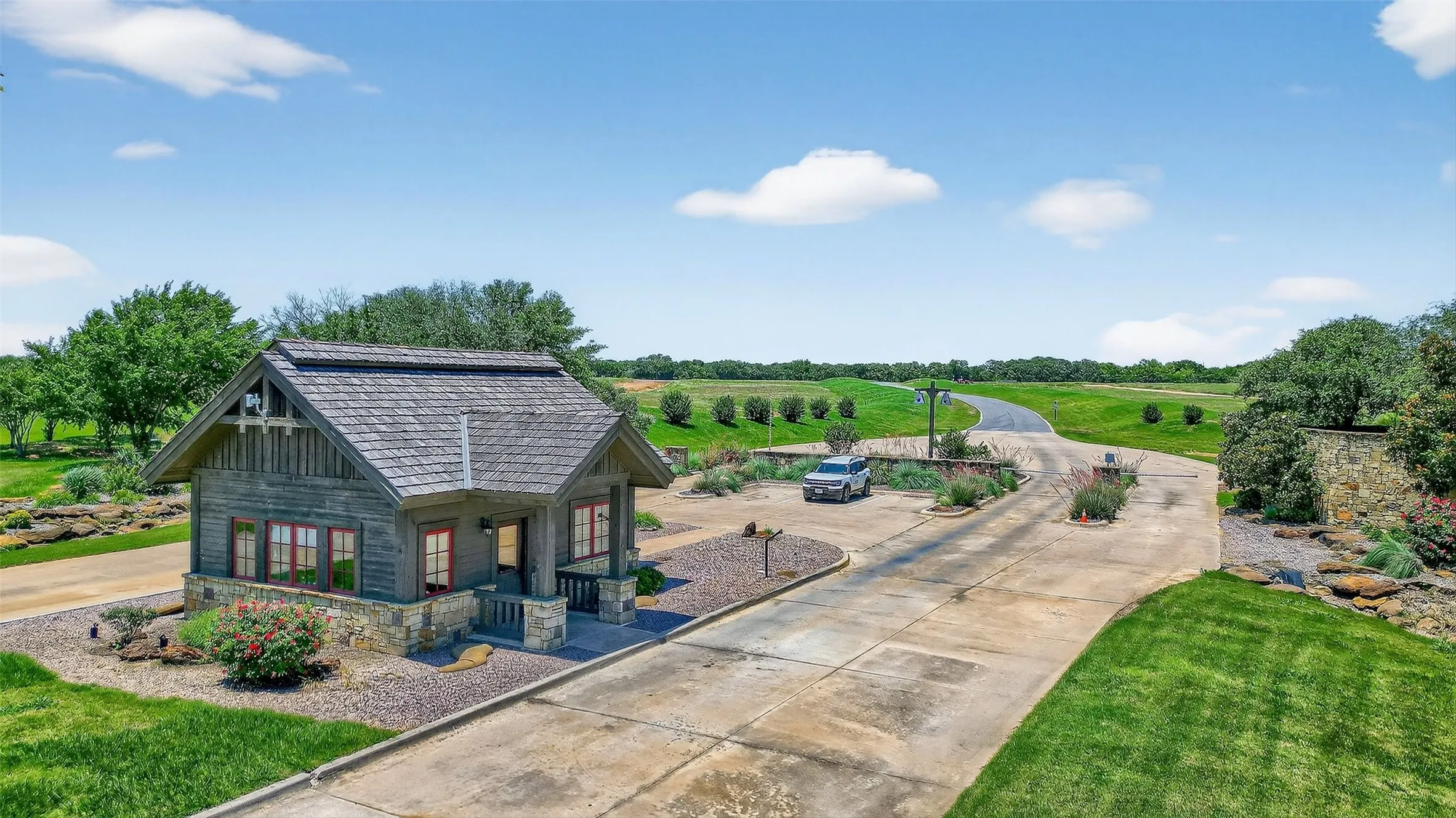 Surrounding community with a yard, a porch, and driveway