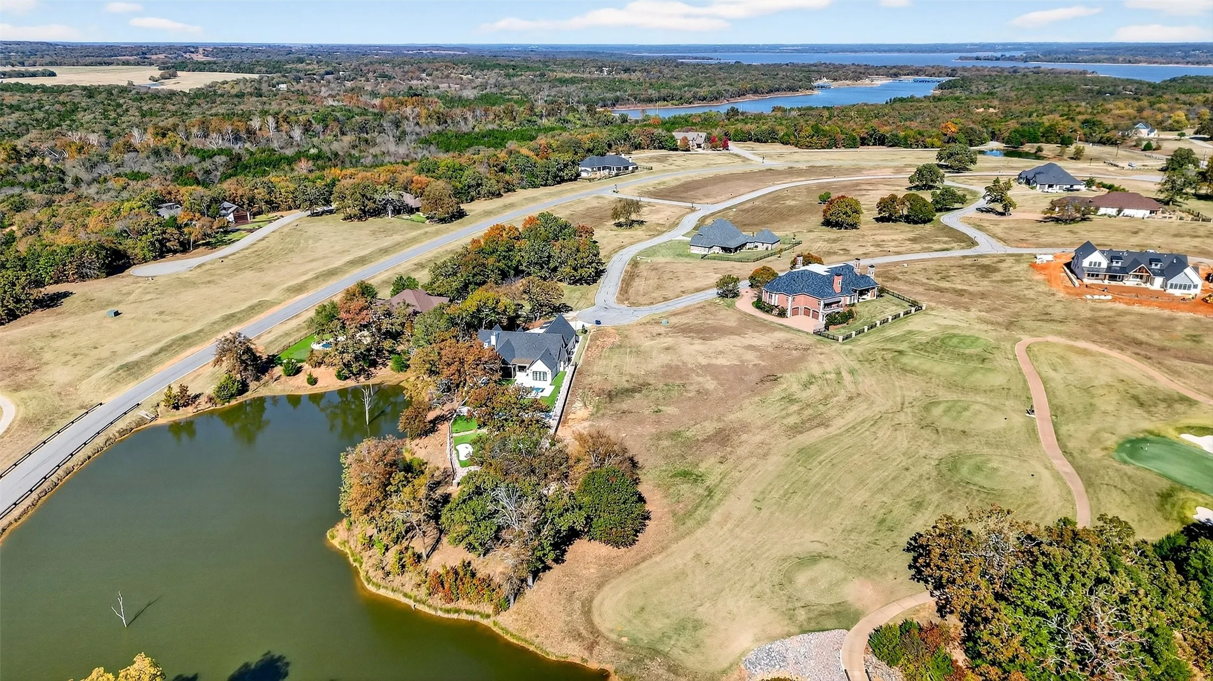 Aerial overview of property's location with a large body of water