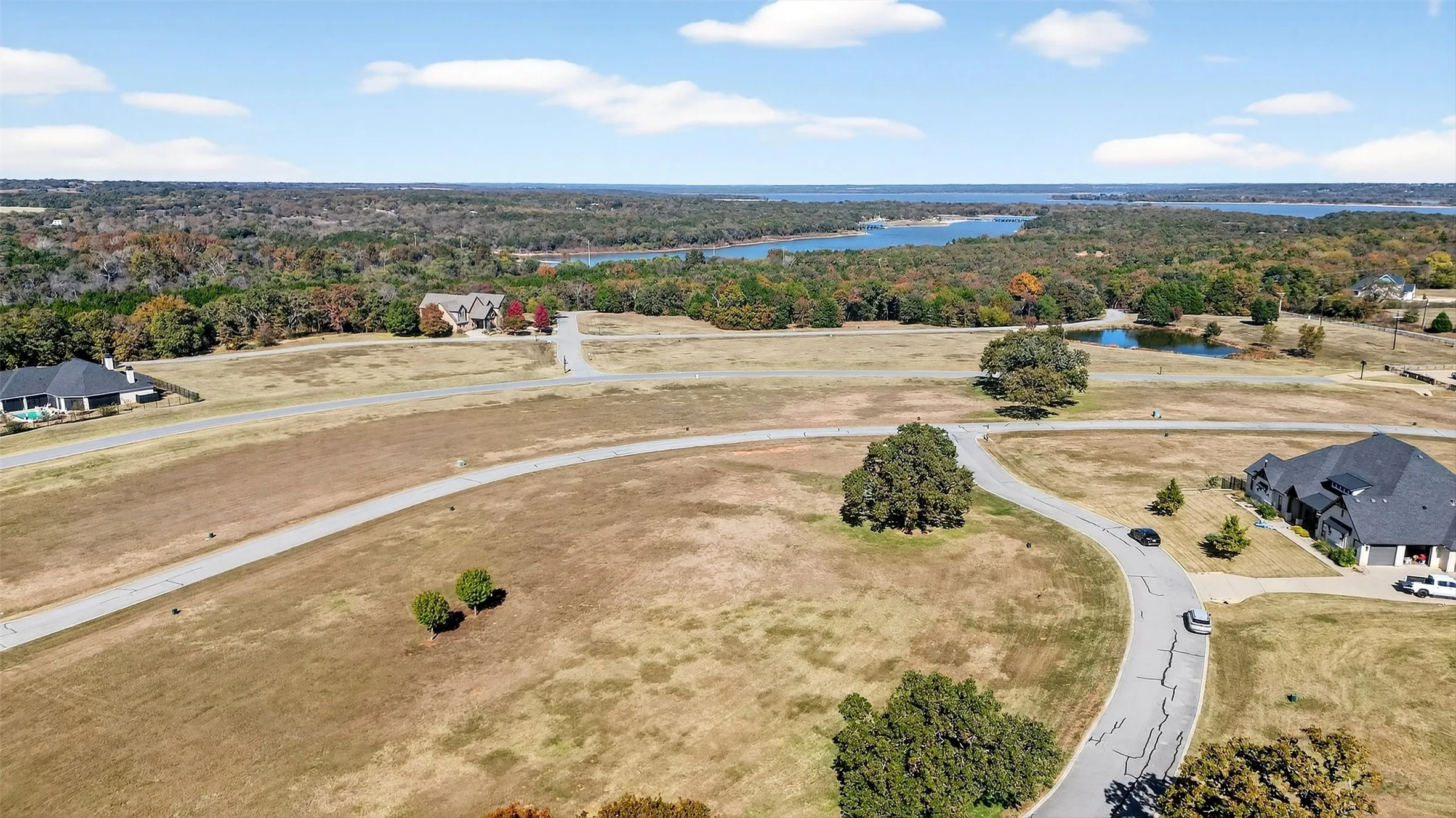 Bird's eye view of a heavily wooded area and a large body of water