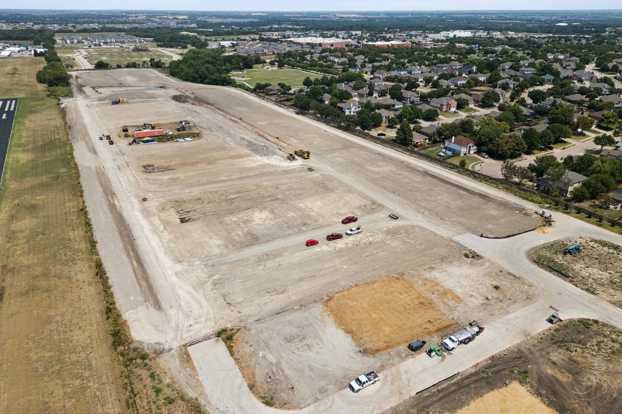Roads, Taxiways and Underground Utilities Completed.