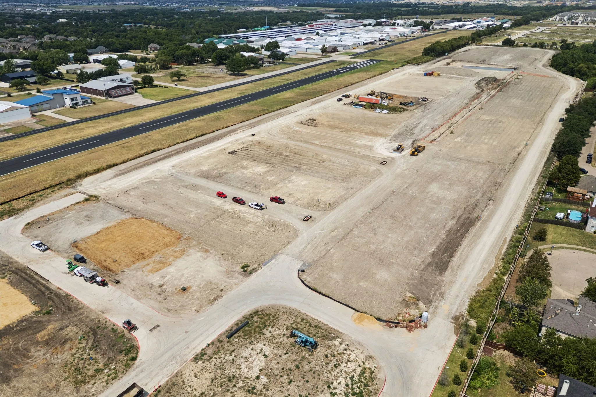Roads, Taxiways and Underground Utilities Completed.