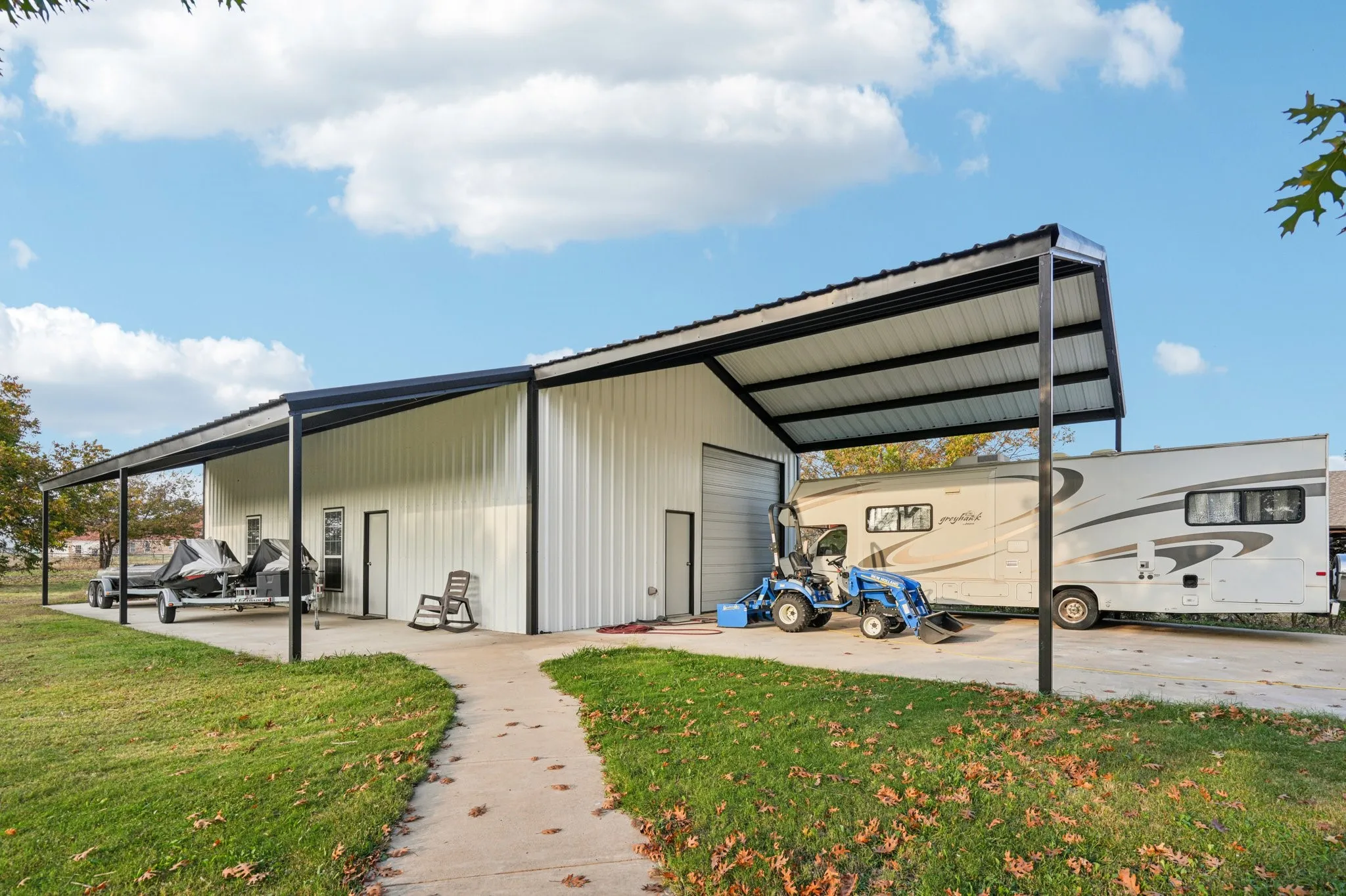 40X50 shop! 2 RV height rolling door, RV height front awning. Large covered space for parking or seperate patio