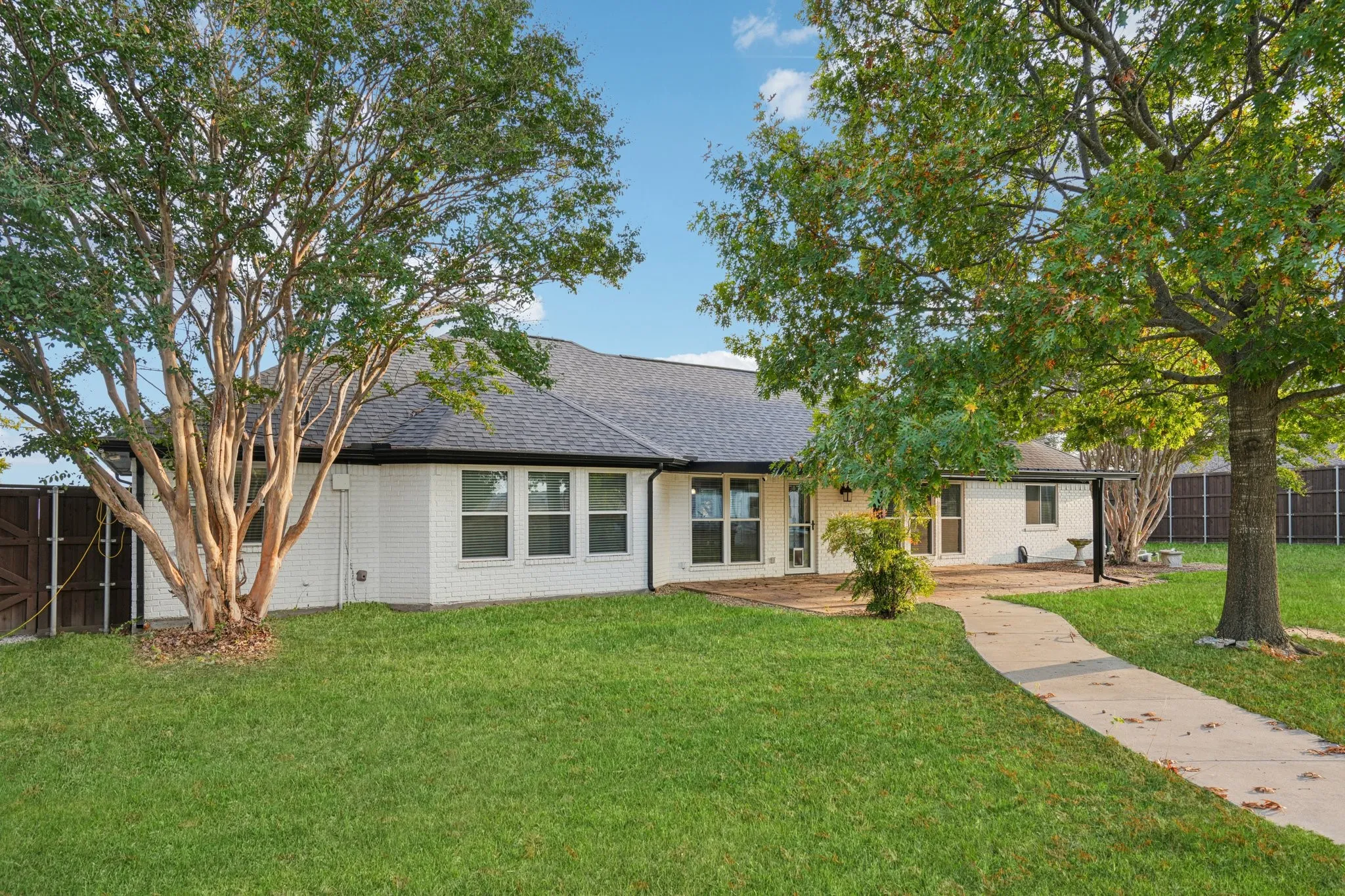 Rear view of house and back yard
