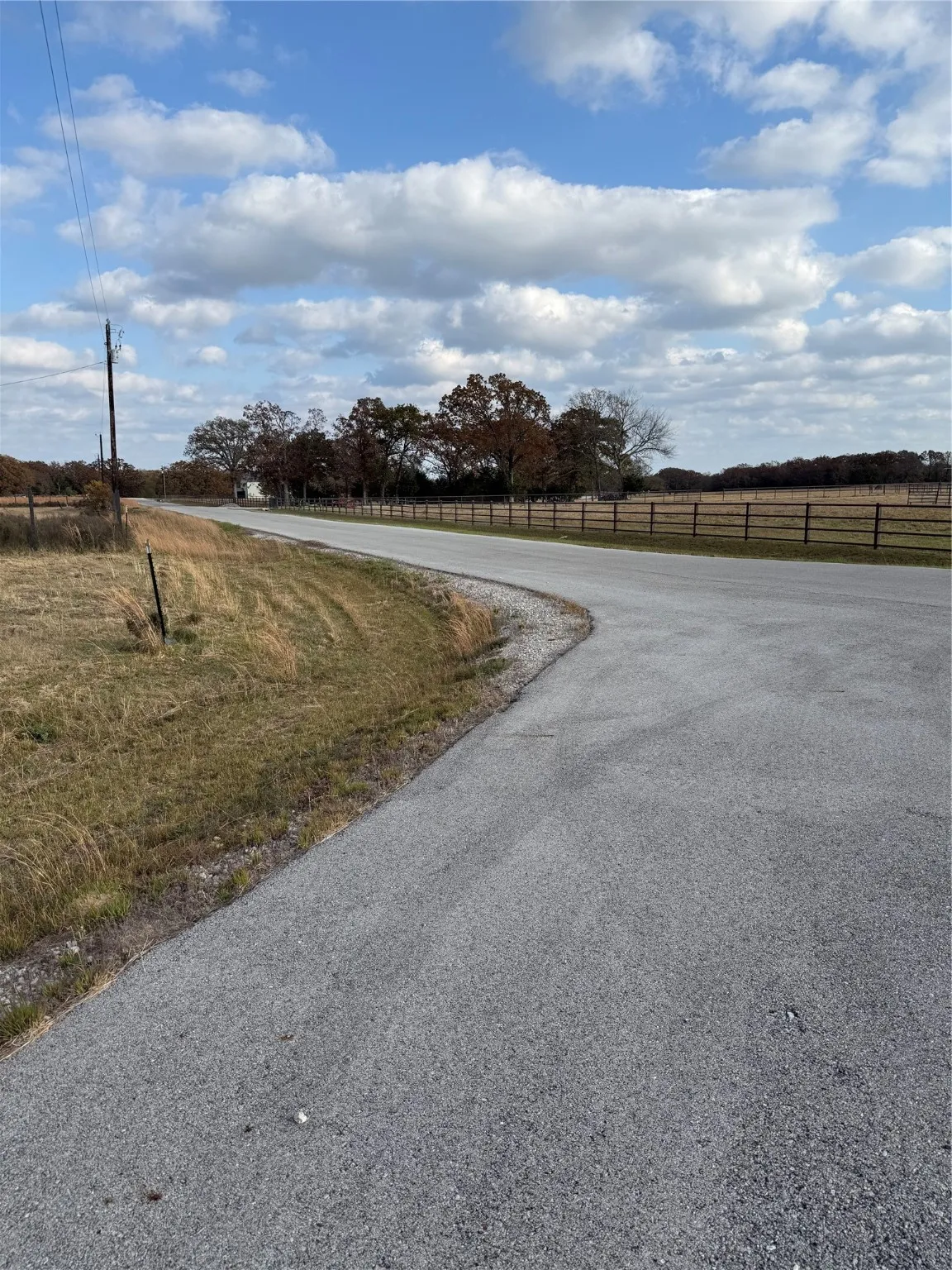View of asphalt street featuring a view of countryside
