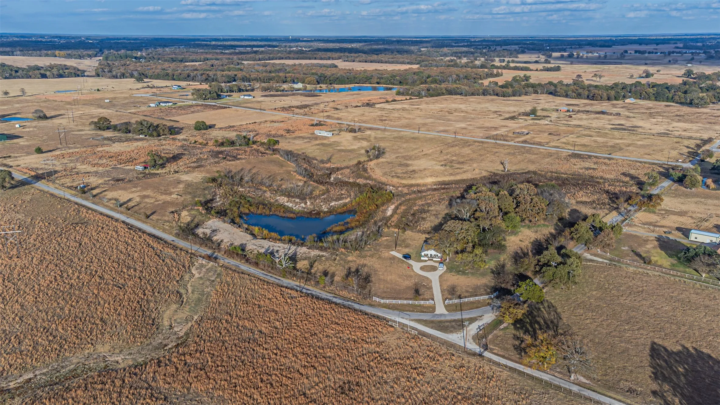 View of property location featuring rural landscape and a nearby body of water