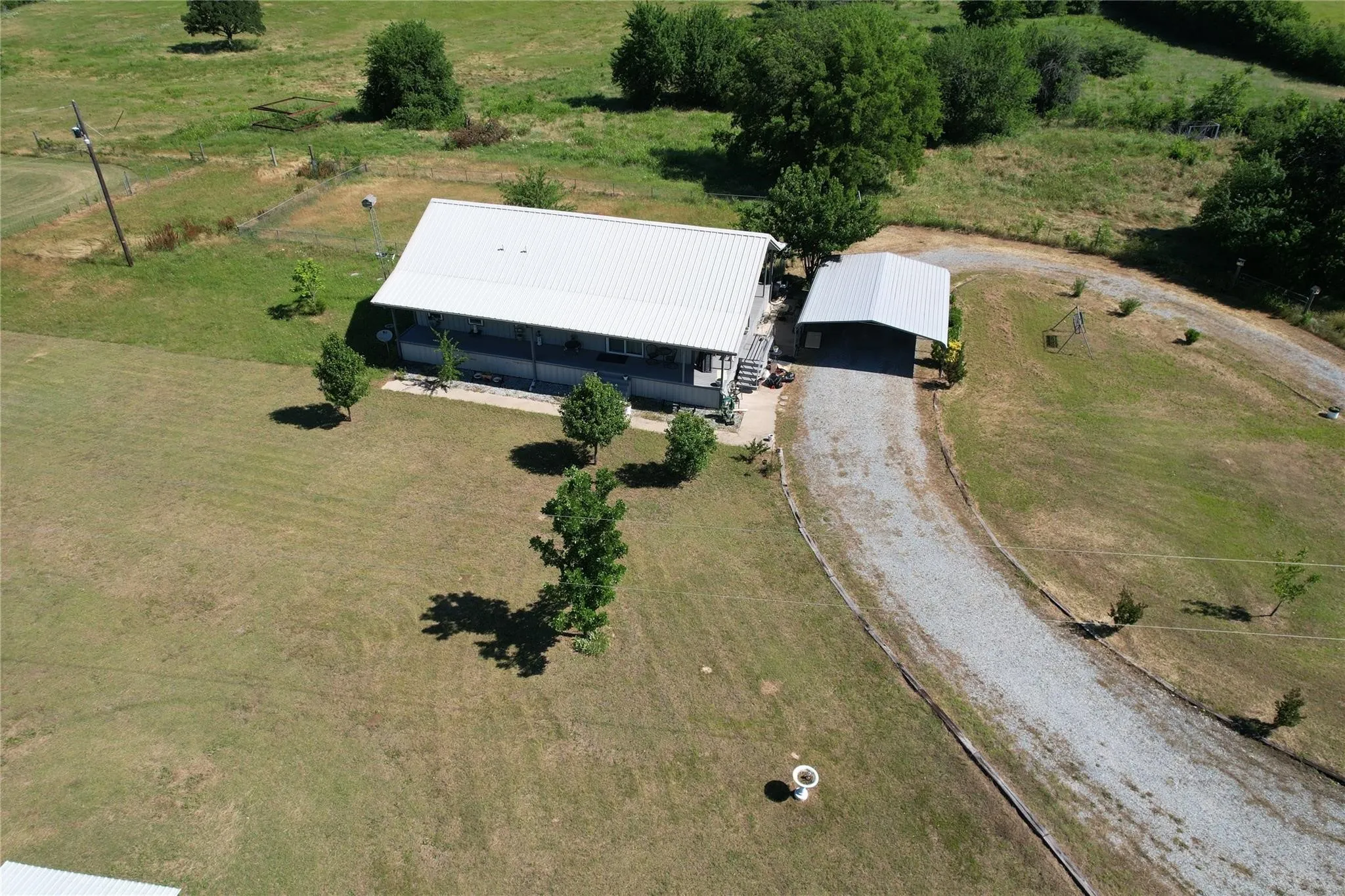 Aerial view of property and surrounding area with rural landscape