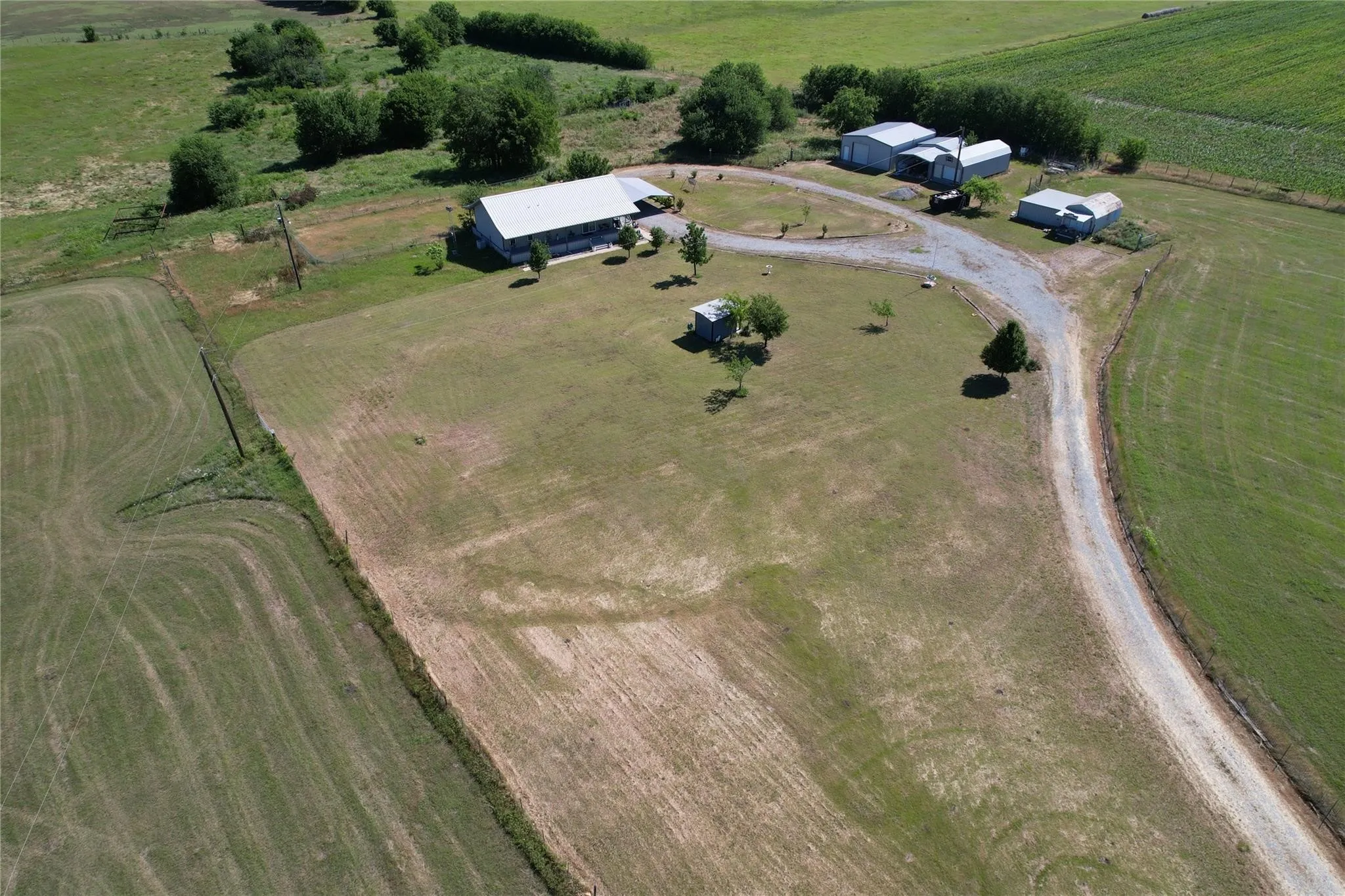 Aerial view of property and surrounding area with rural landscape