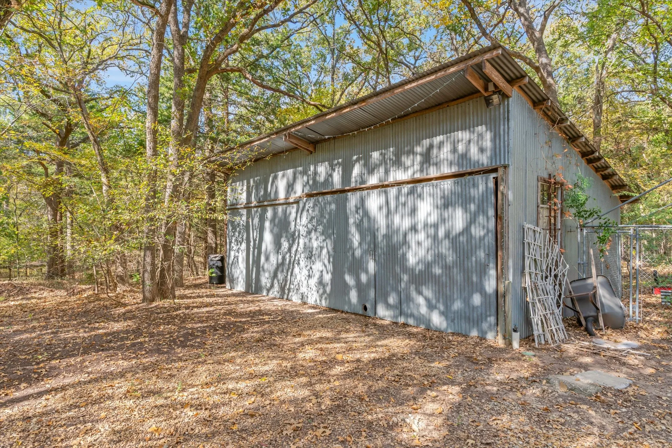 Older workshop has concrete floors and electricity for your projects or storage.