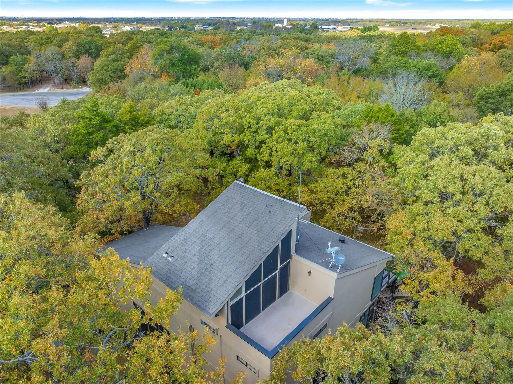 Topmost floor is an open concept glass-walled space to use as a Bedroom or Living Area and opens to a private balcony with a view at and above the tree tops.