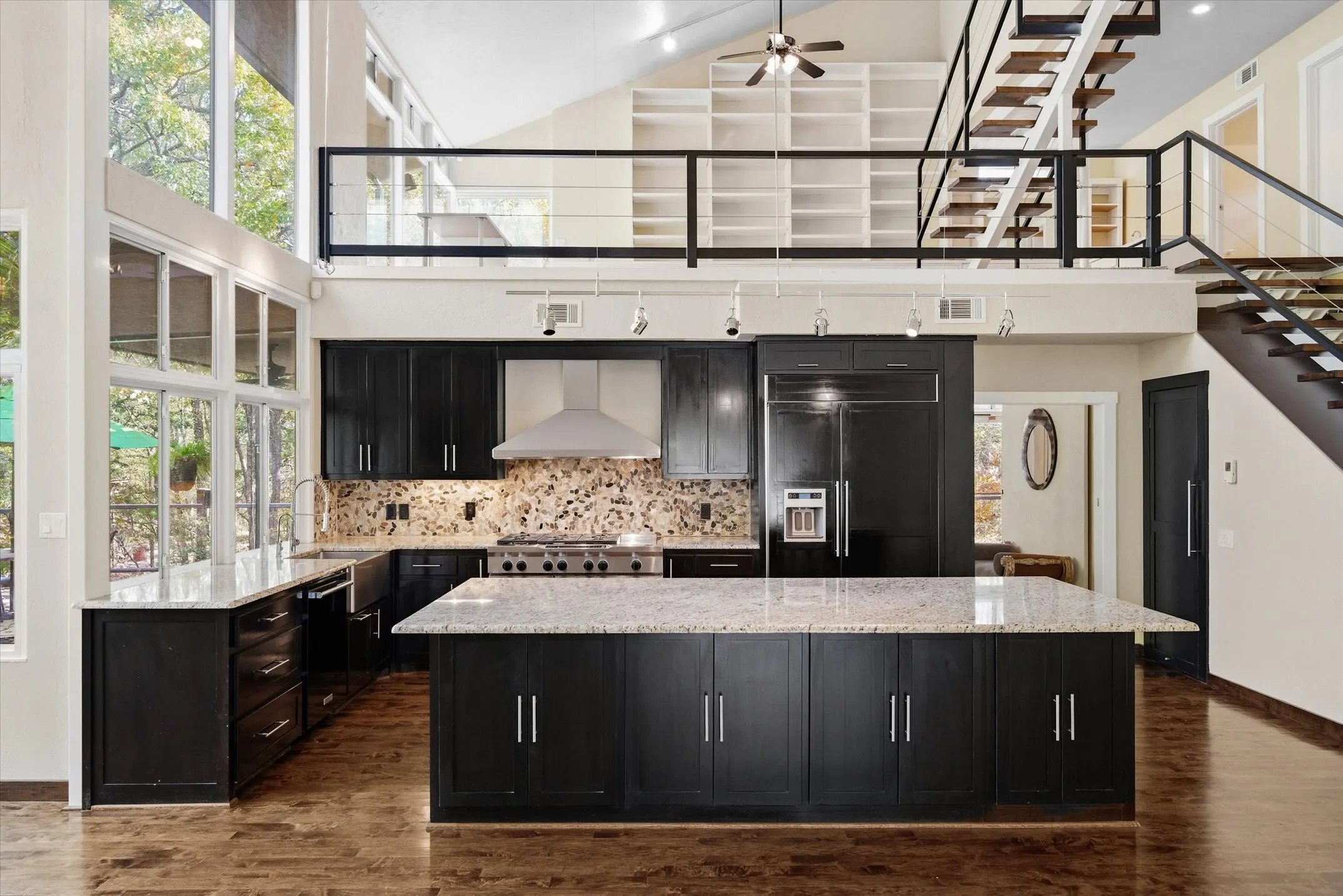Huge Island allows for bar seating and lots of storage. Past the Kitchen is the Primary Bedroom