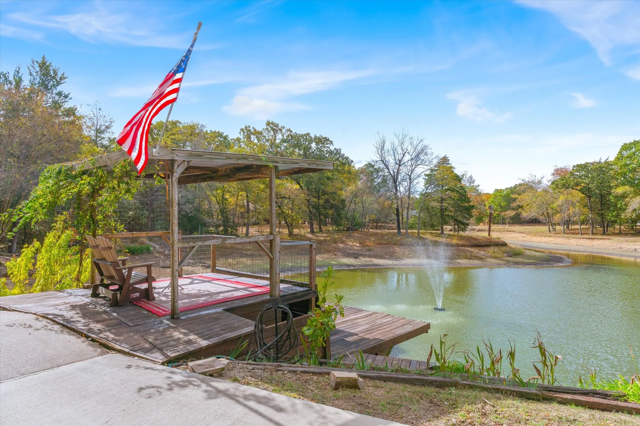 Covered Dock offers a view of the pond as well as a lower deck for swimming, fishing or sunning. Note: Pond is usually much more full.
