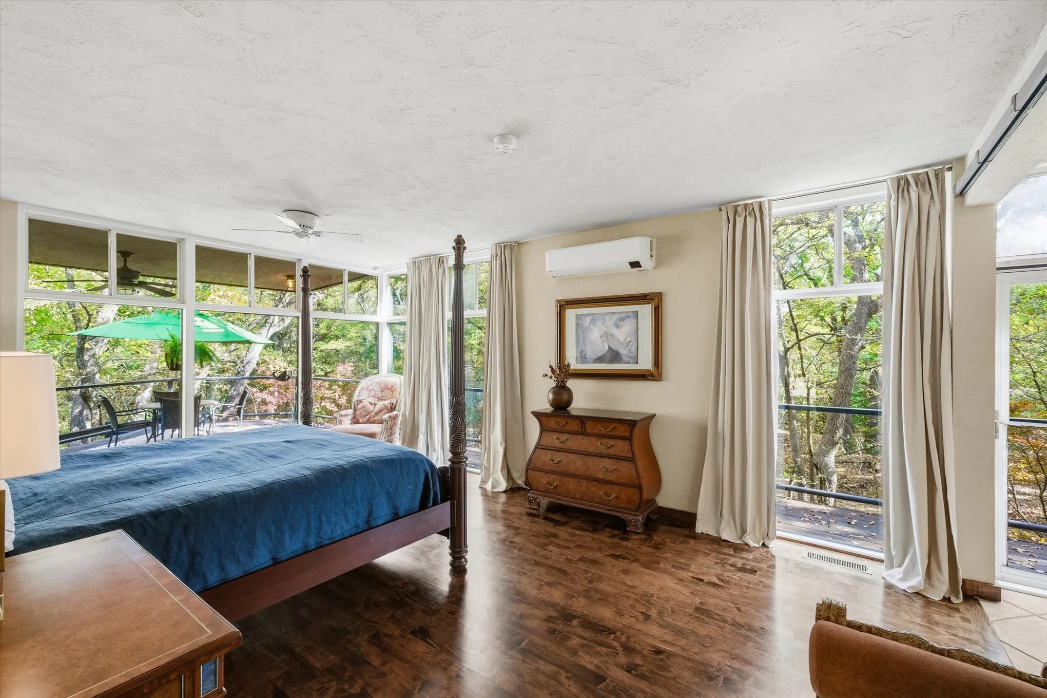 Feel like you are sleeping in the tree tops with this windowed Primary Bedroom