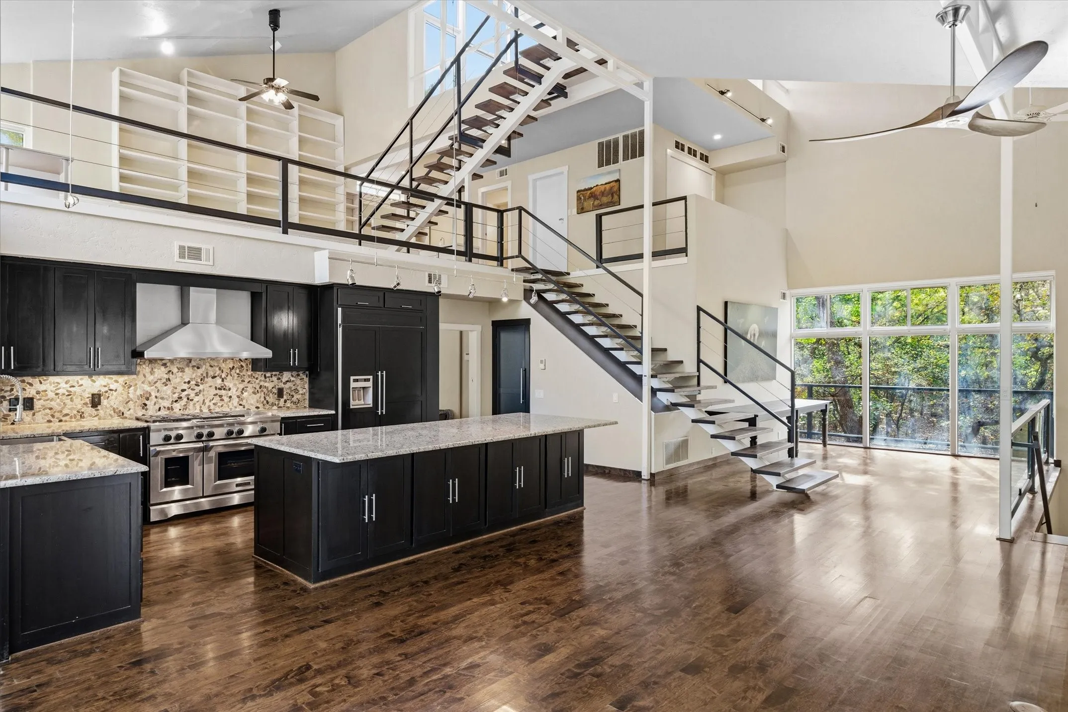Note the flow to the loft as well as the Dining Area past the staircase