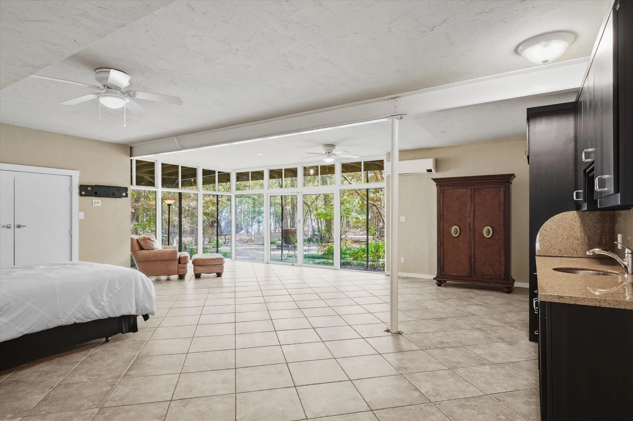 Large and open with its own entry to the garage and to the patio and outdoor living.