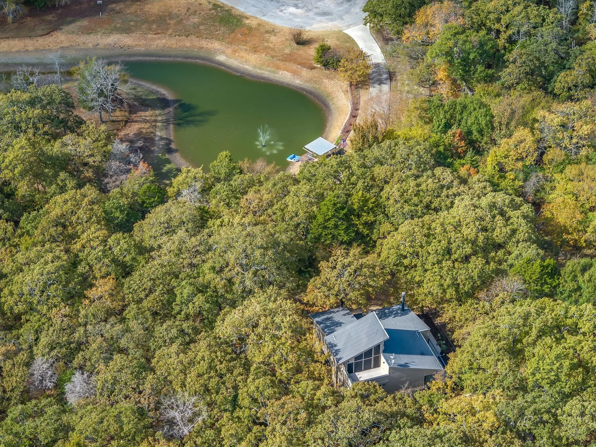 Home is secreted in the woods and offers seclusion and a peaceful pond.