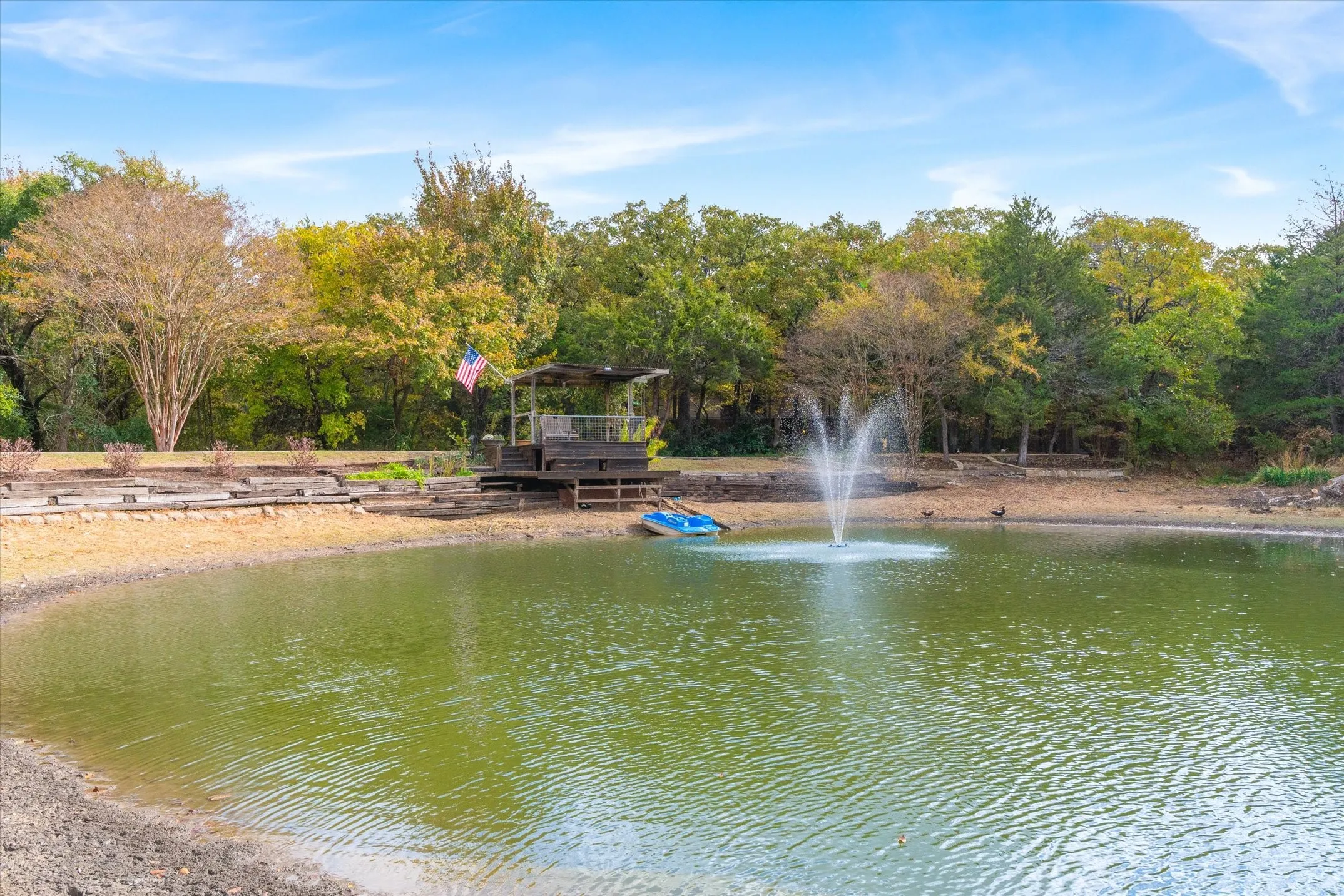 You circle the pond and enter the property through a secure gate