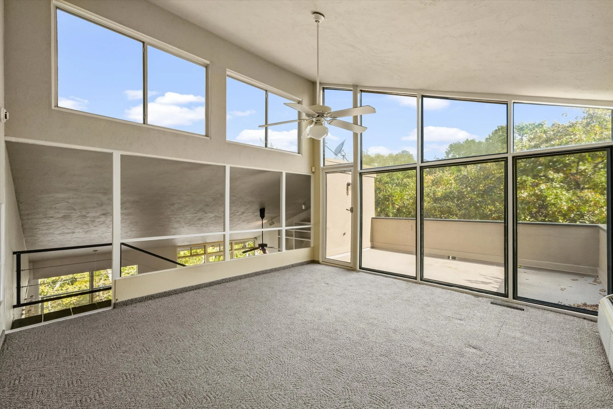 Up another flight of floating stairs is the open concept 3rd bedroom with spectacular views, and a private balcony. This space also makes a stunning additional Living Area.
