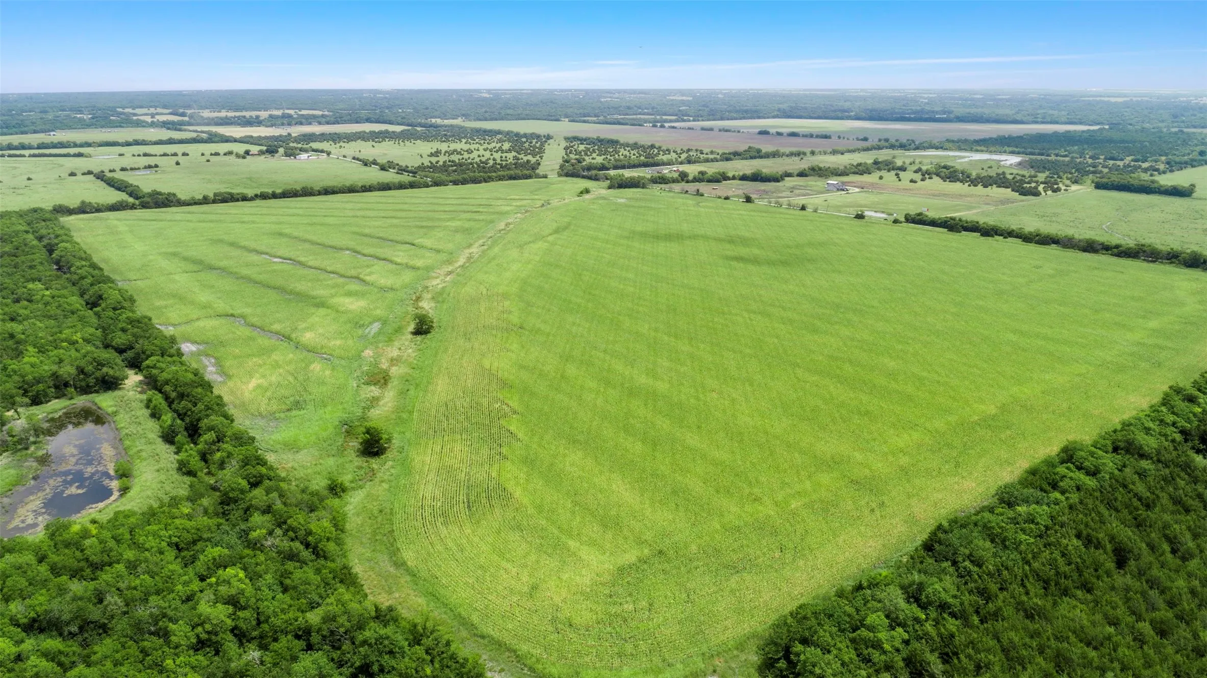 Aerial view of sparsely populated area with abundant farmland