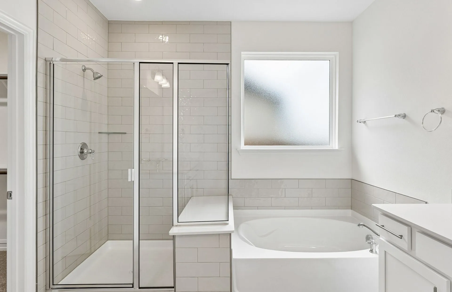 Owners bath with separate tub and shower