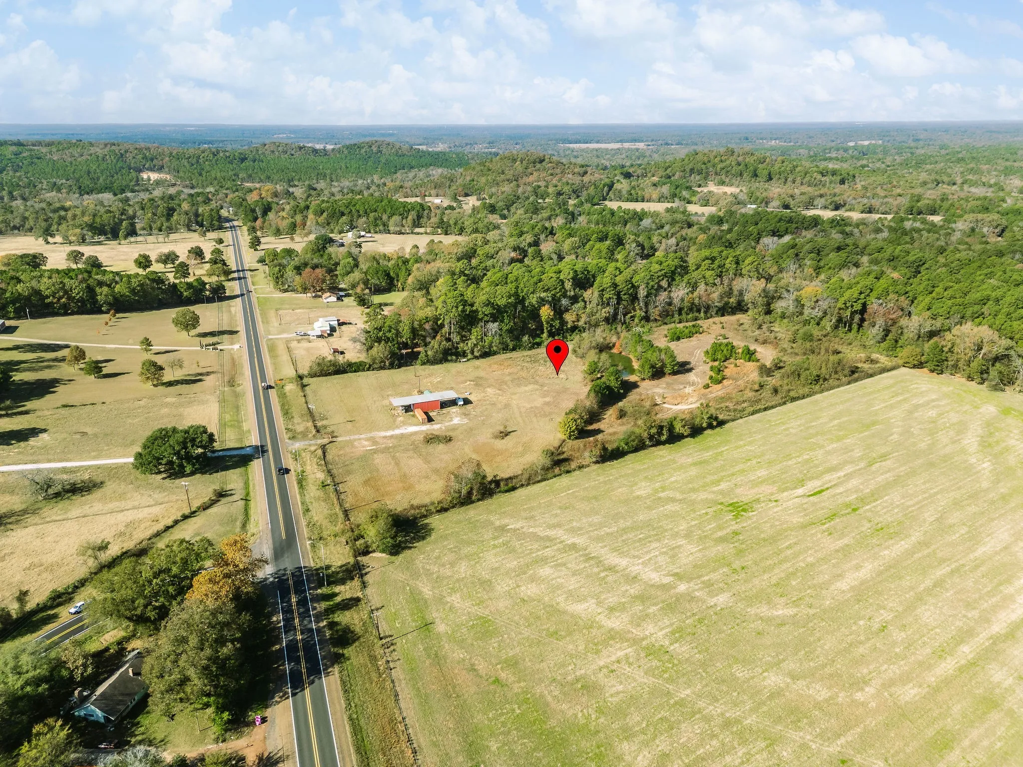 Aerial overview of property's location with rural landscape