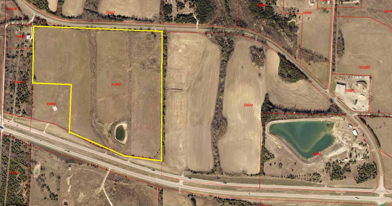 Aerial map of property and surrounding area featuring property parcel outlined