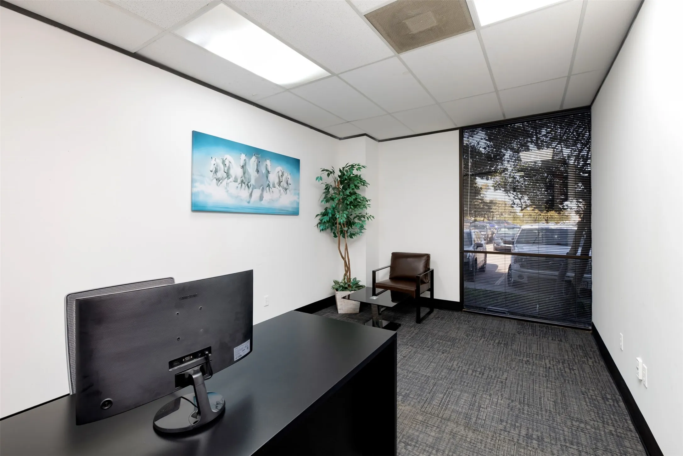 Office space featuring a drop ceiling