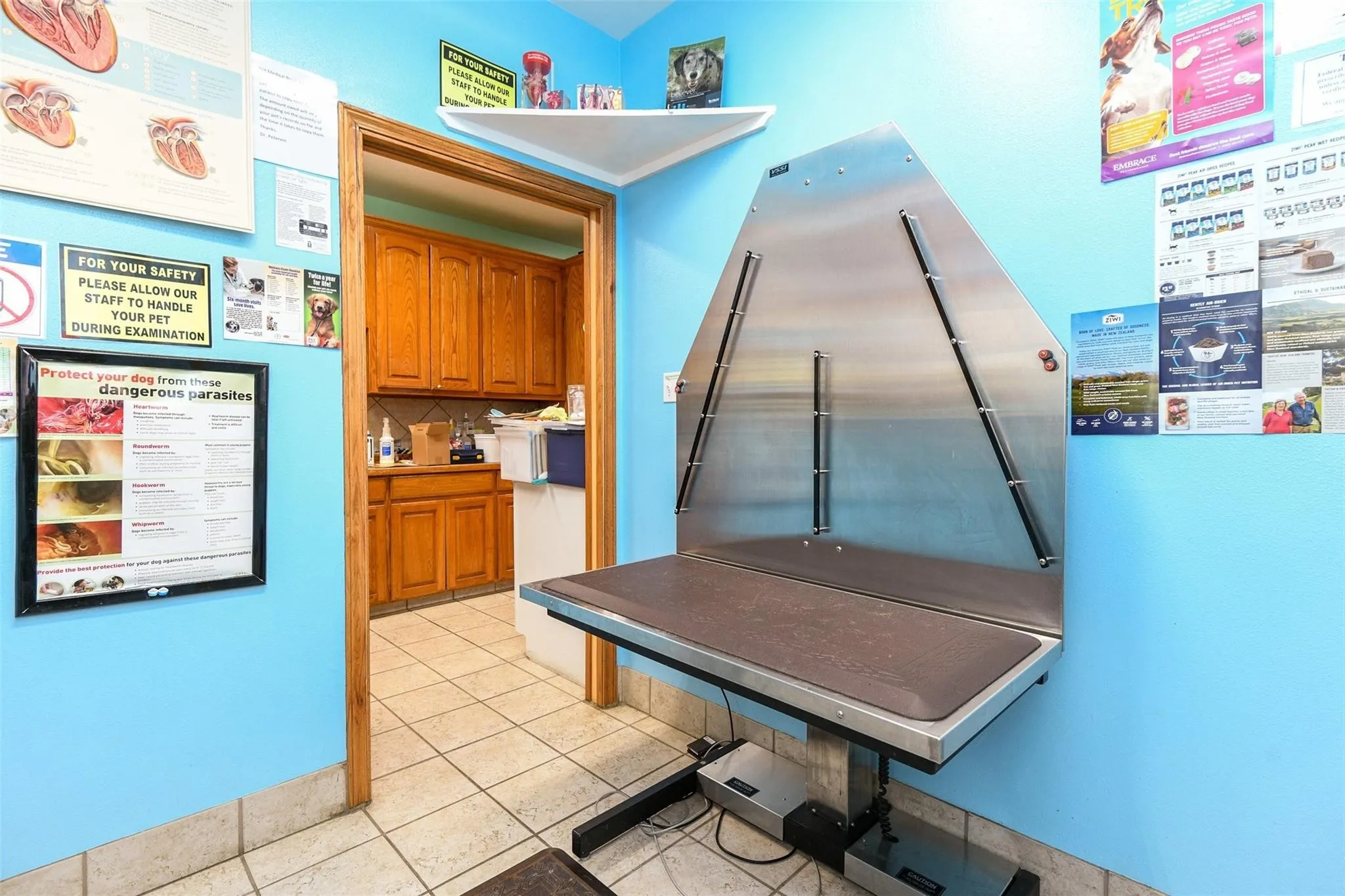 Kitchen with brown cabinets and stainless steel refrigerator