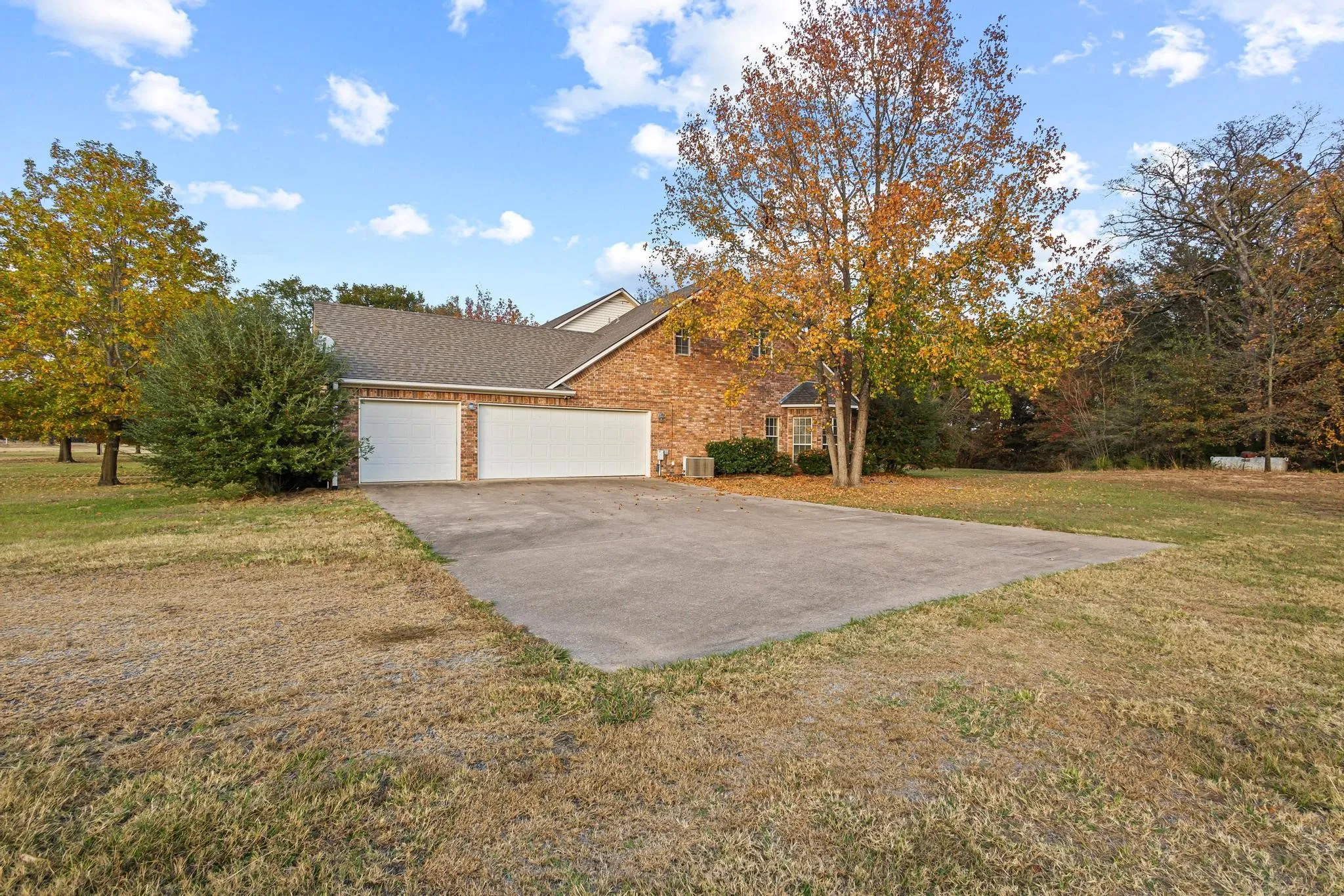 3 car garage with an extra outside concrete slab