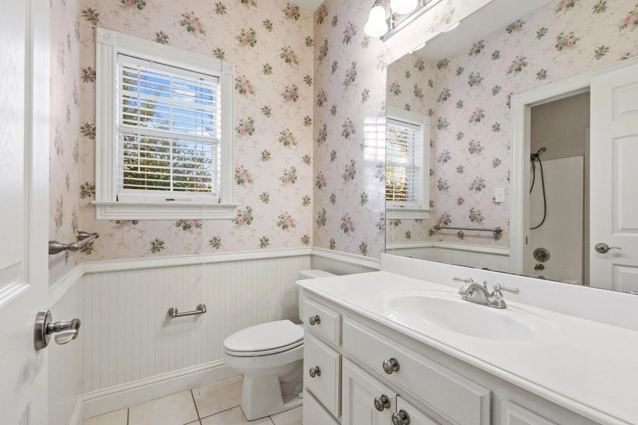 Jack & Jill bath with commode & sink, shower shared with other bedroom