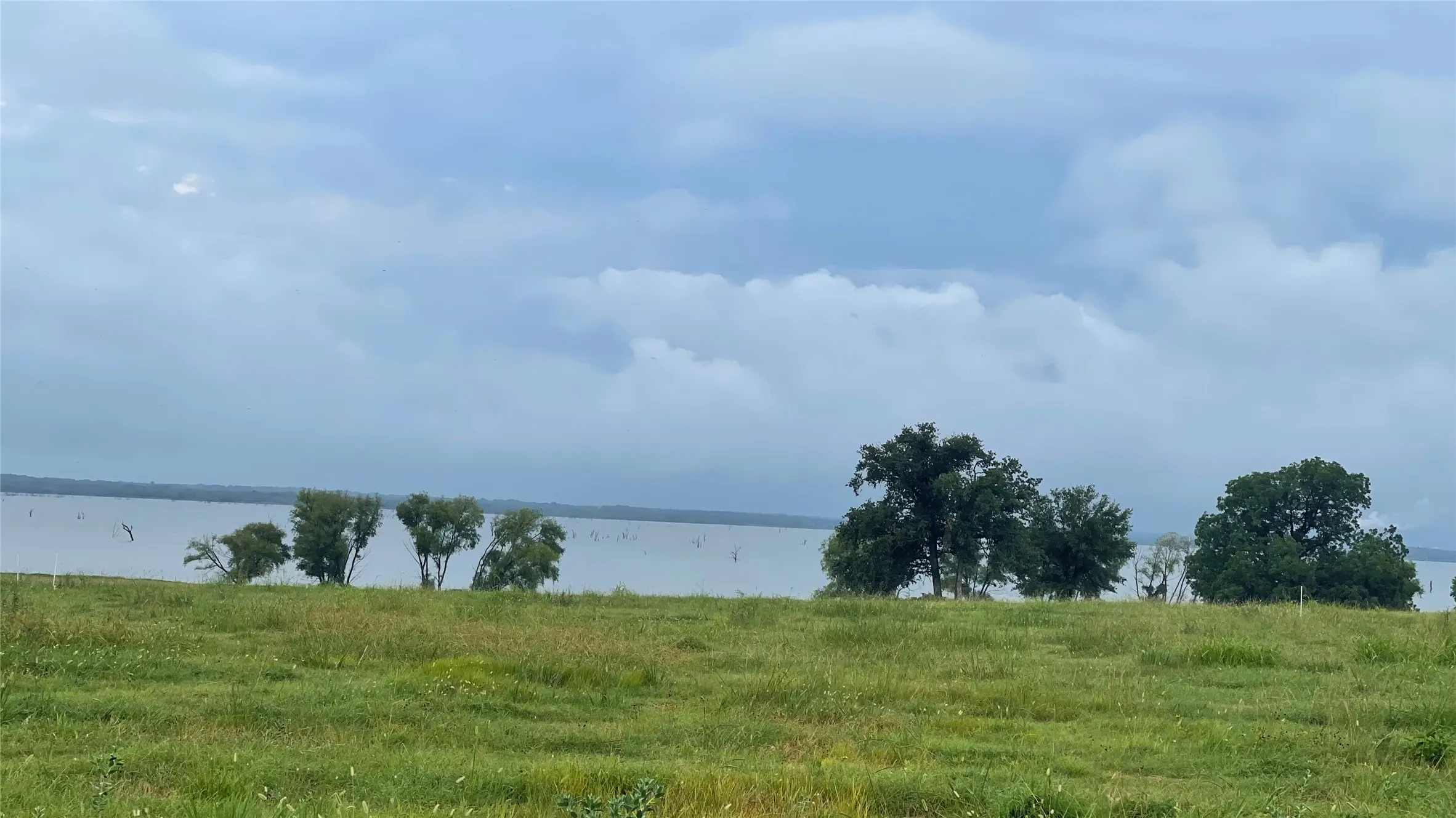 View of water feature with a rural view