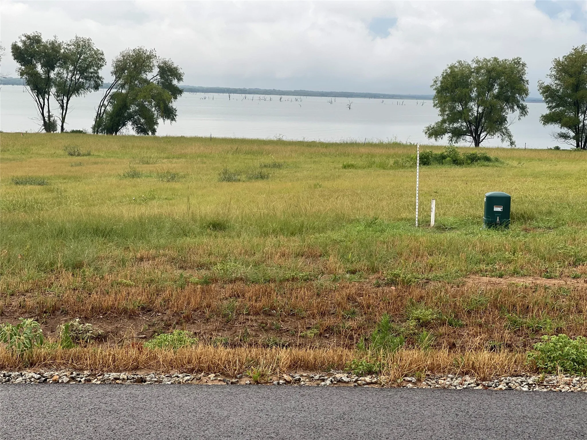 View of yard with a water view