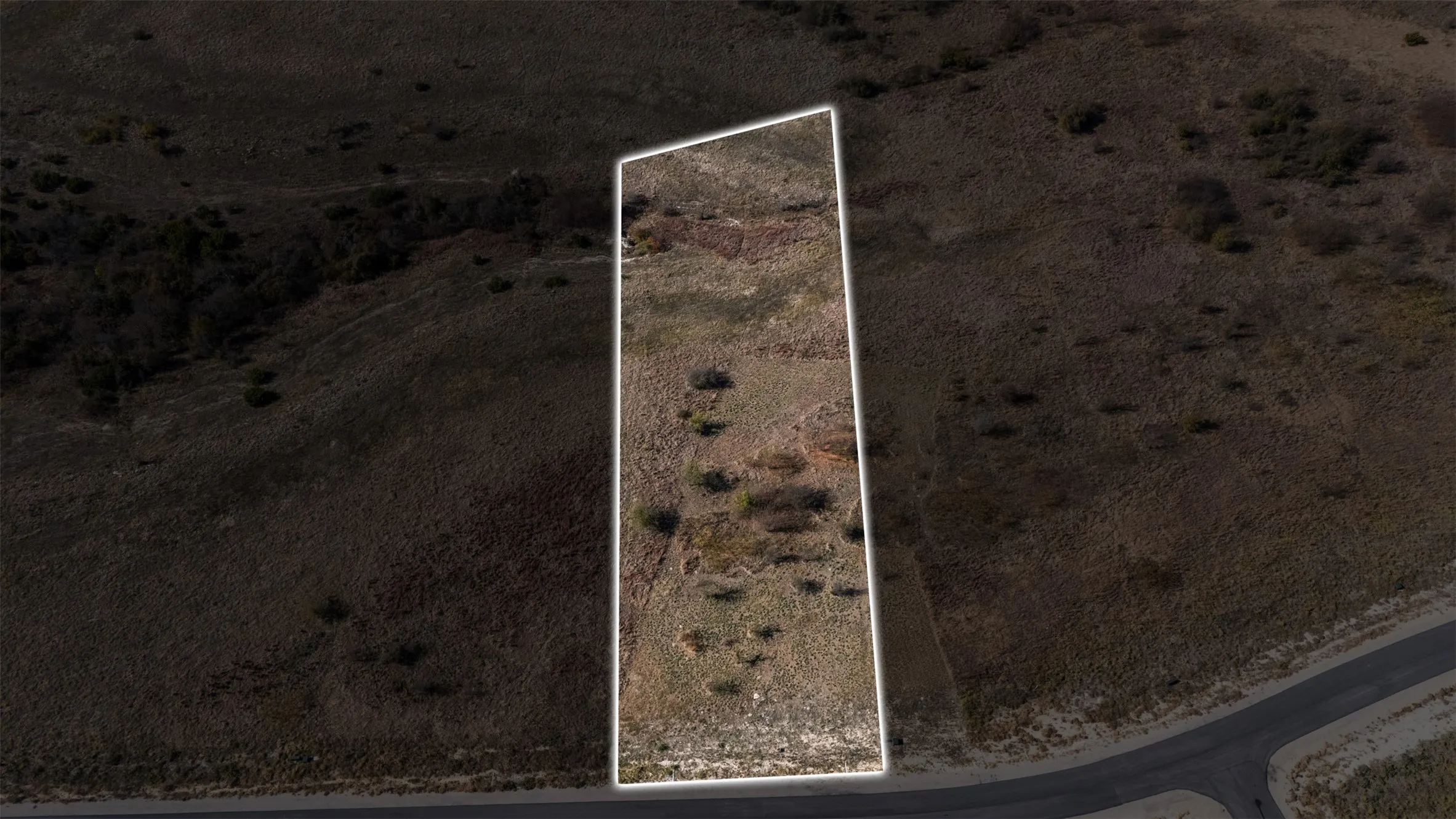 Aerial view of property's location featuring property parcel outlined