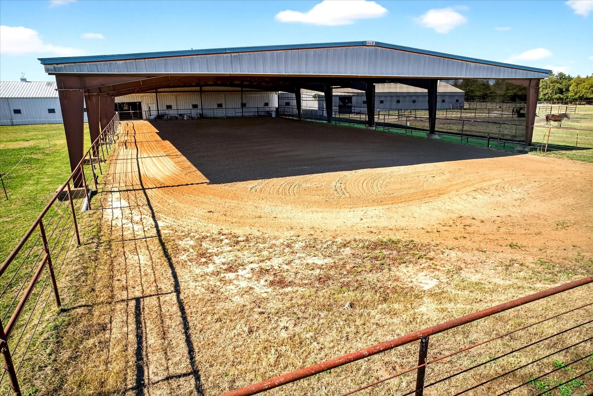 additional arena space adjacent to covered arena