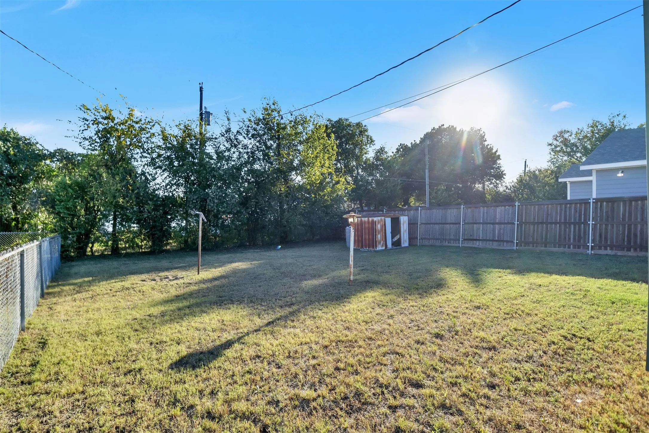 View of fenced backyard
