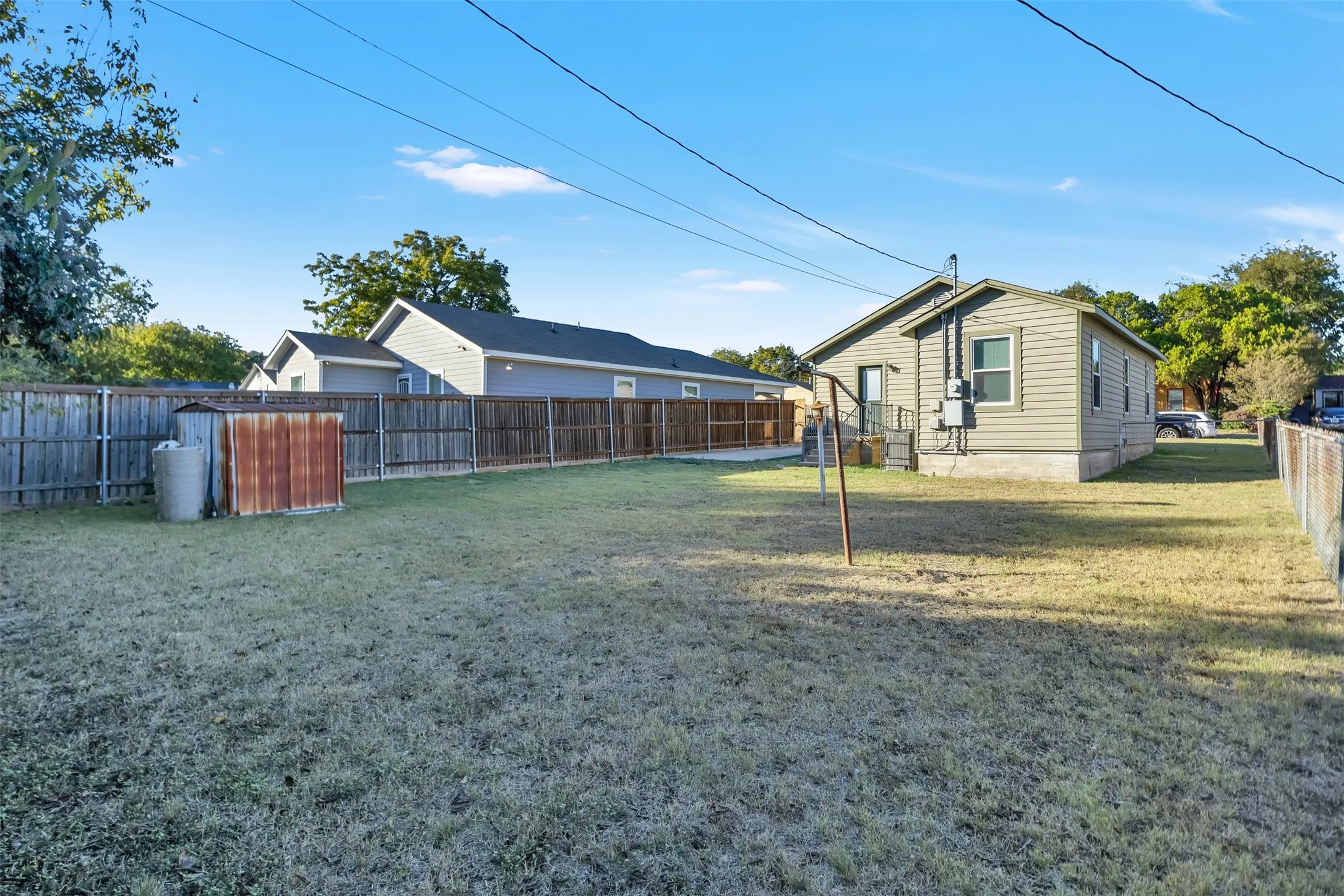 View of fenced backyard