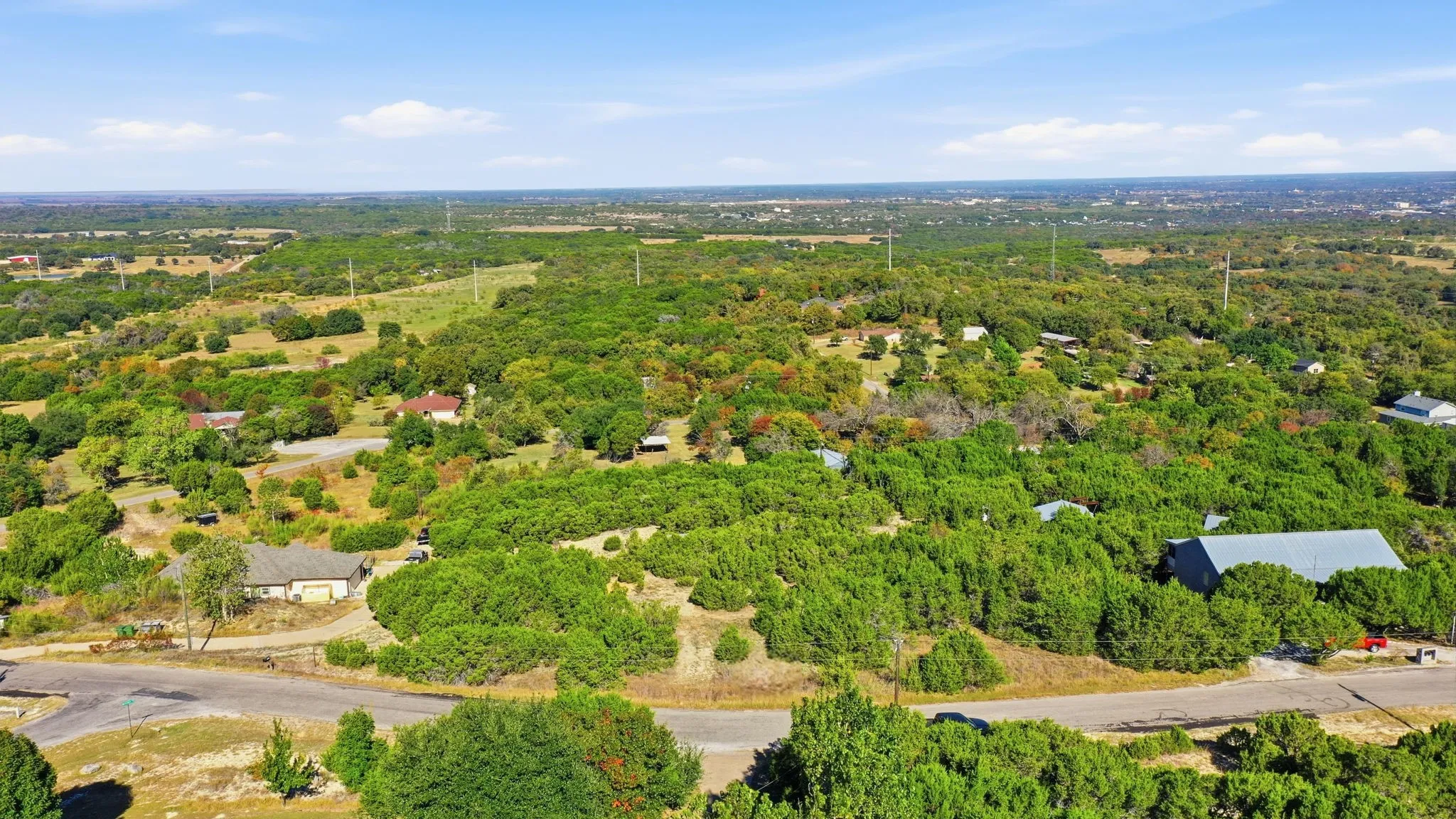 Aerial overview of property's location with a forest