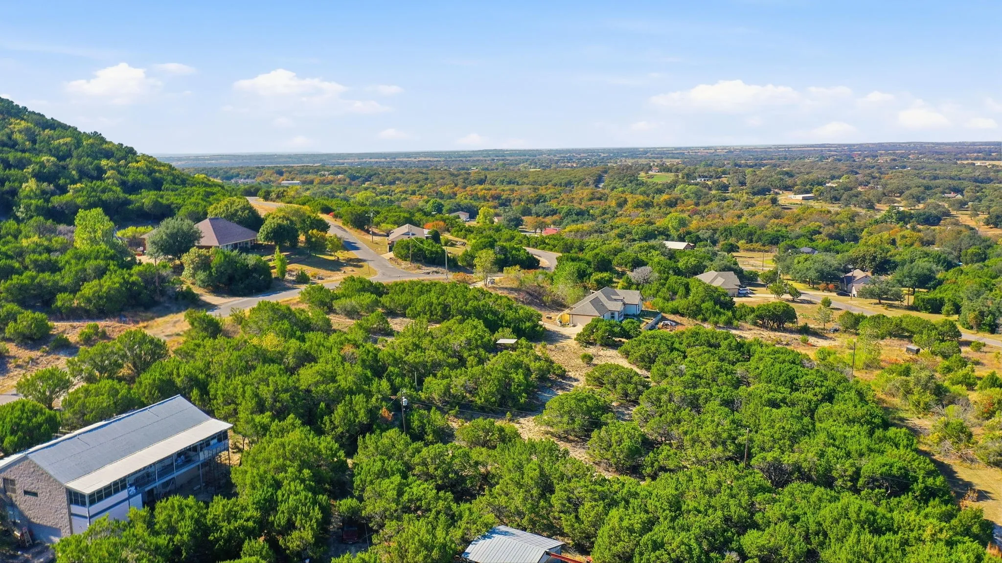 Drone / aerial view of a heavily wooded area