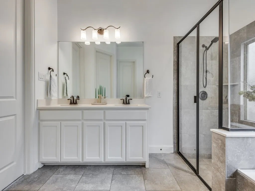 Primary bath with vanity and shower.