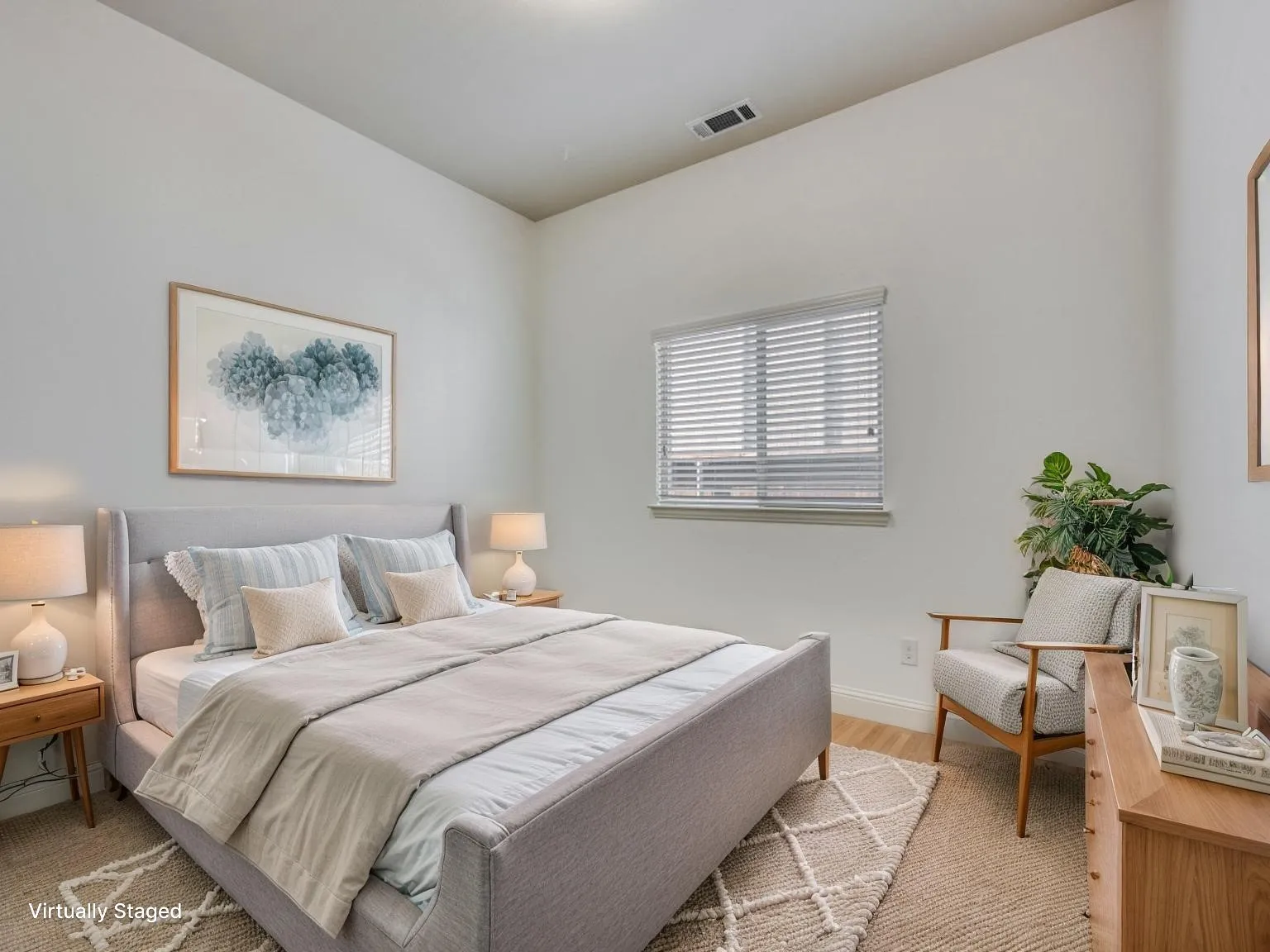 Bright interior space with light wood-finish flooring, a window with horizontal blinds, and tall ceilings