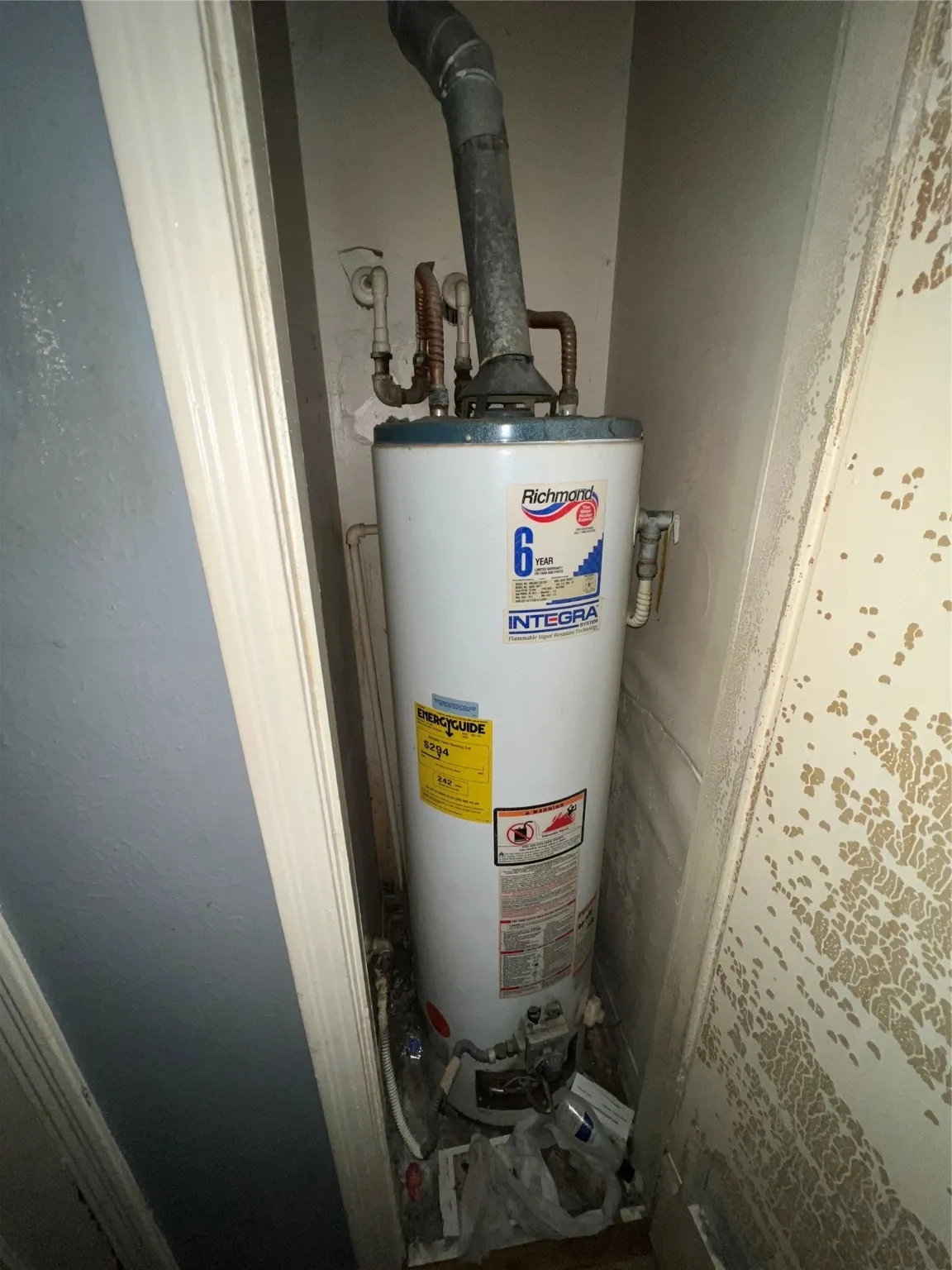 Utility room featuring water heater